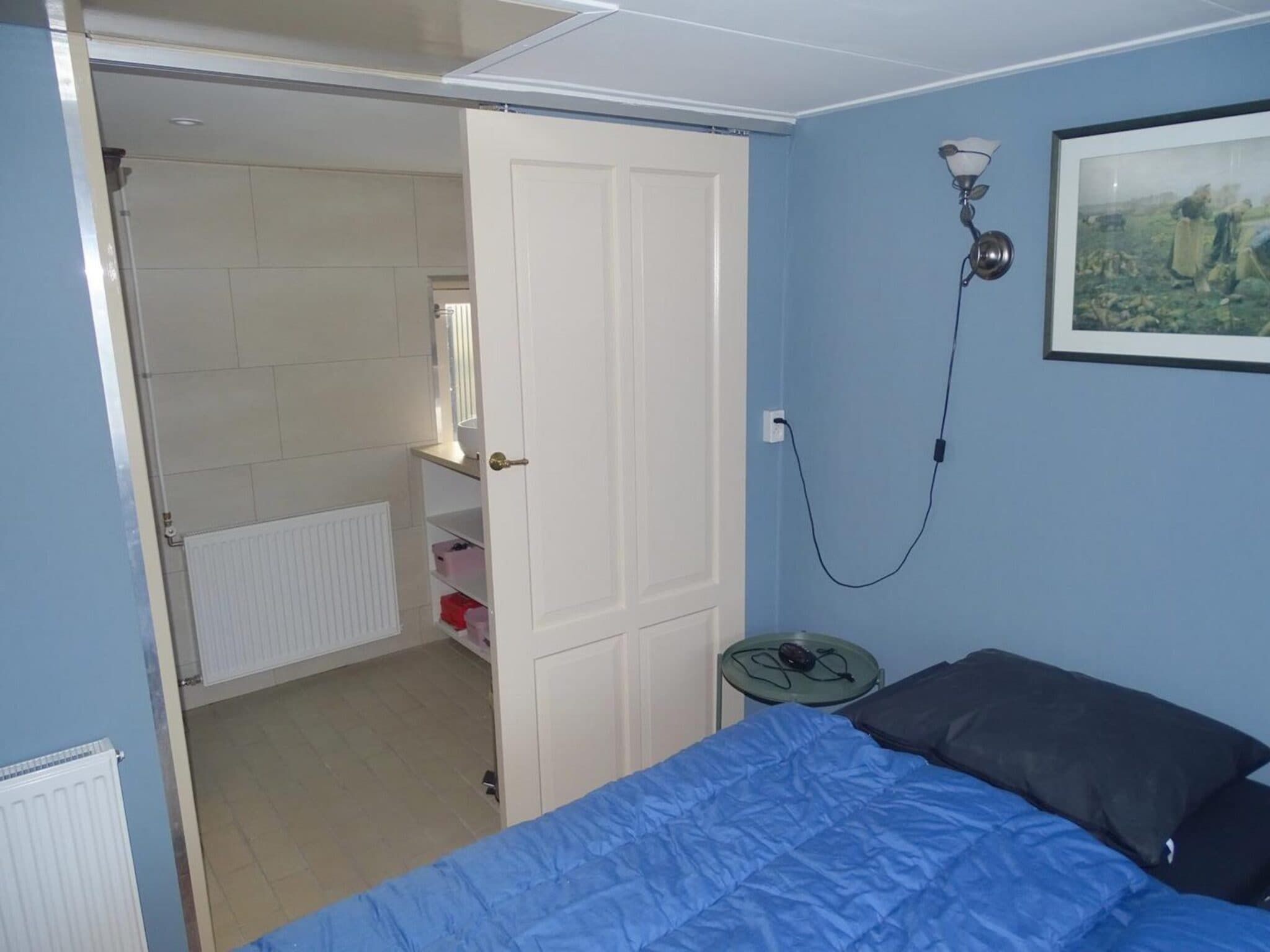 Een slaapkamer van Tragel 37 Schoondijke in Schoondijke