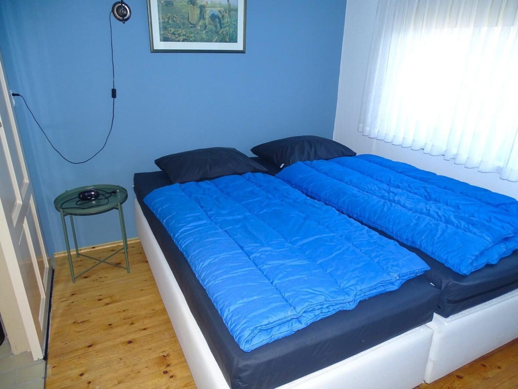 Een slaapkamer van Tragel 37 Schoondijke in Schoondijke