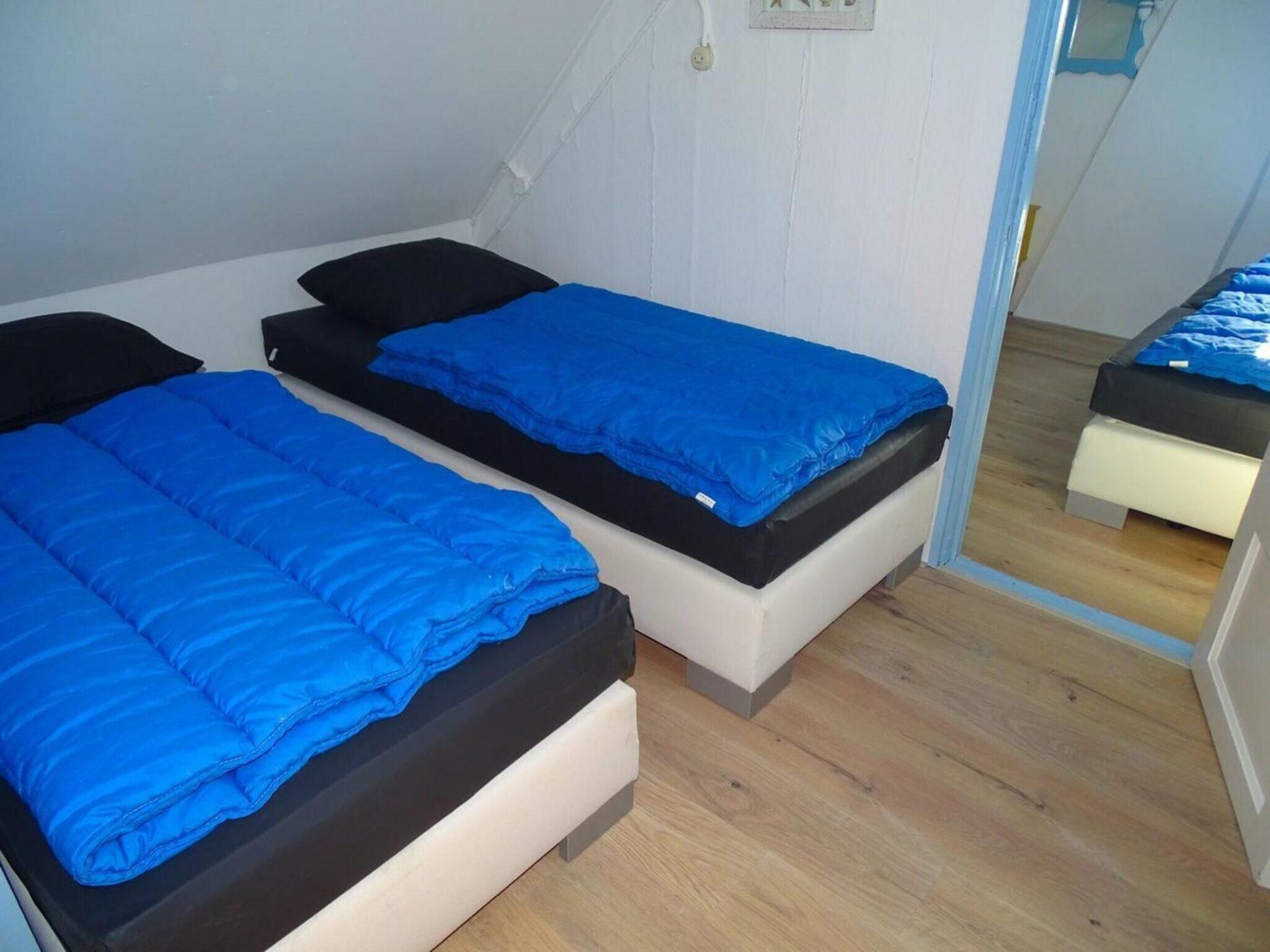 Een slaapkamer van Tragel 37 Schoondijke in Schoondijke