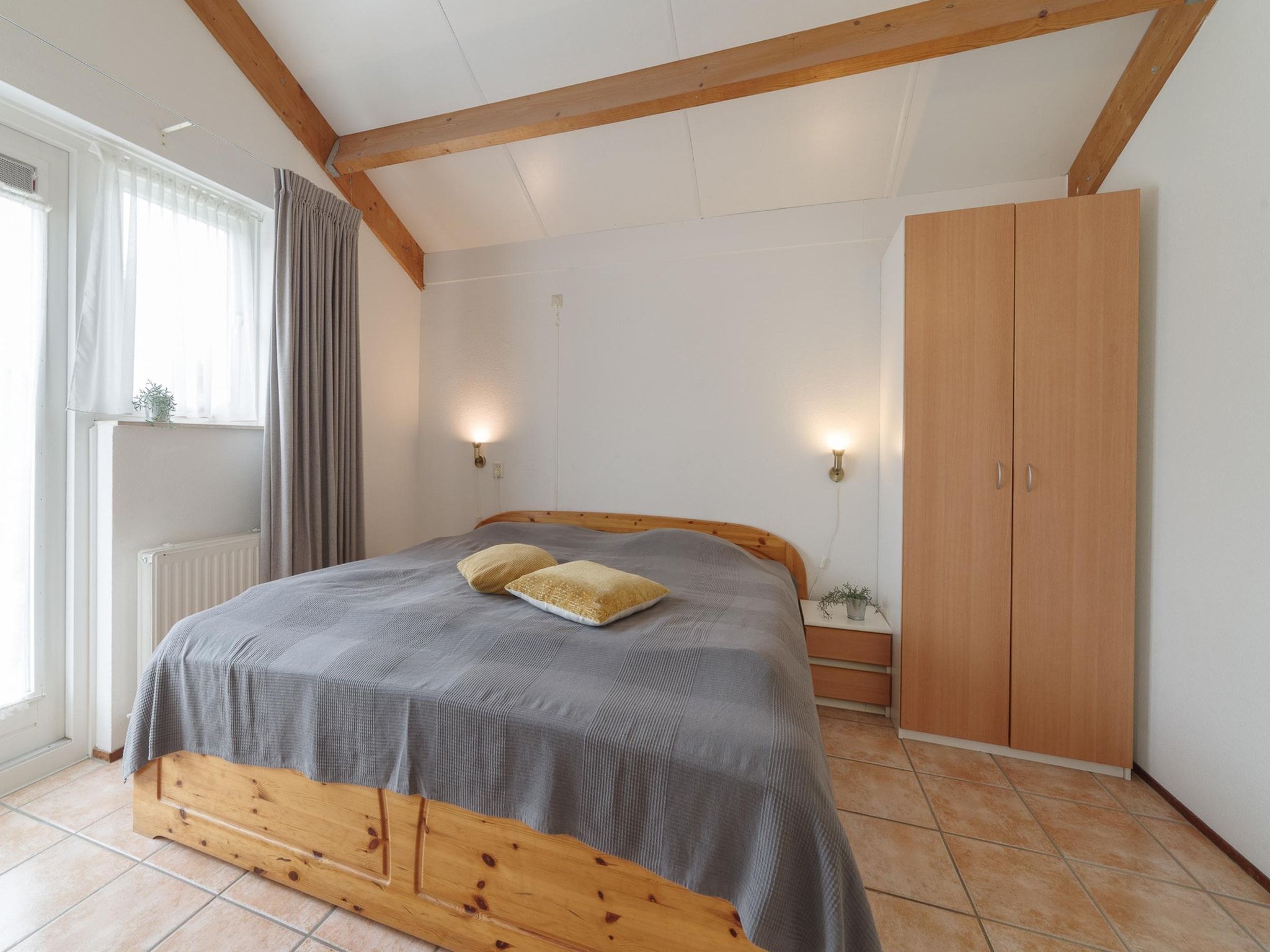 Een slaapkamer van Villapark De Oesterbaai 54 in Wemeldinge