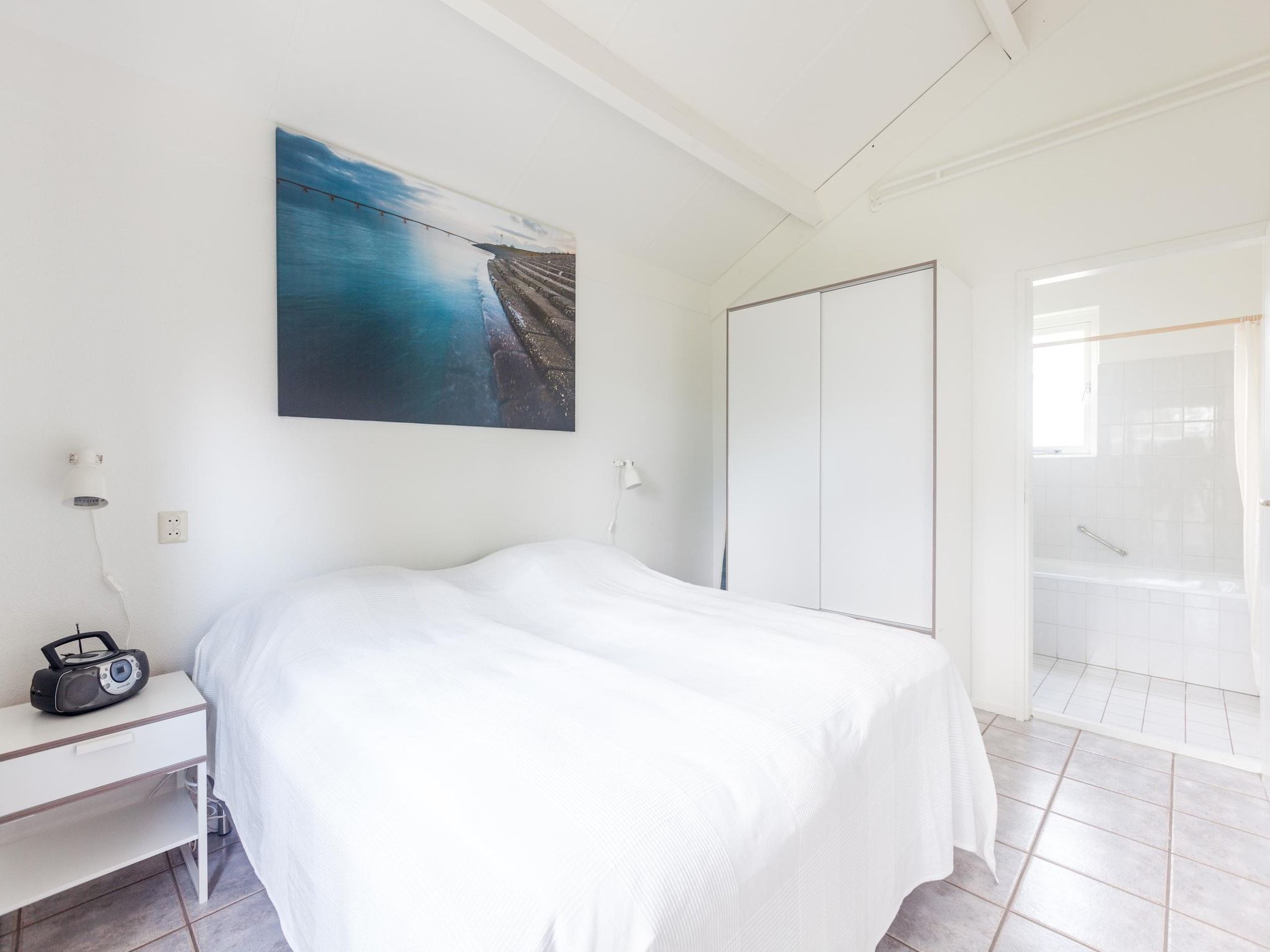 Een slaapkamer van Villapark De Oesterbaai 64 in Wemeldinge