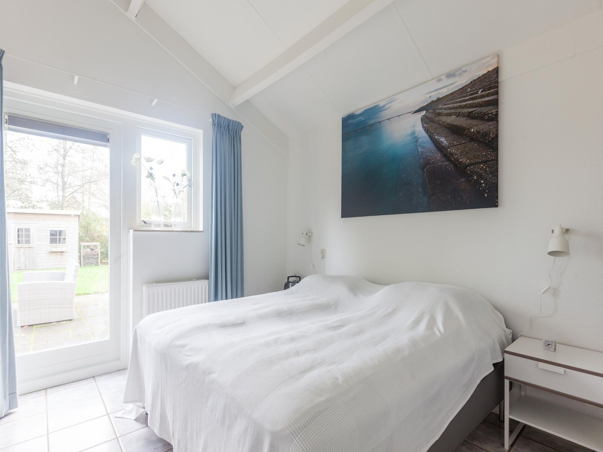 Een slaapkamer van Villapark De Oesterbaai 64 in Wemeldinge