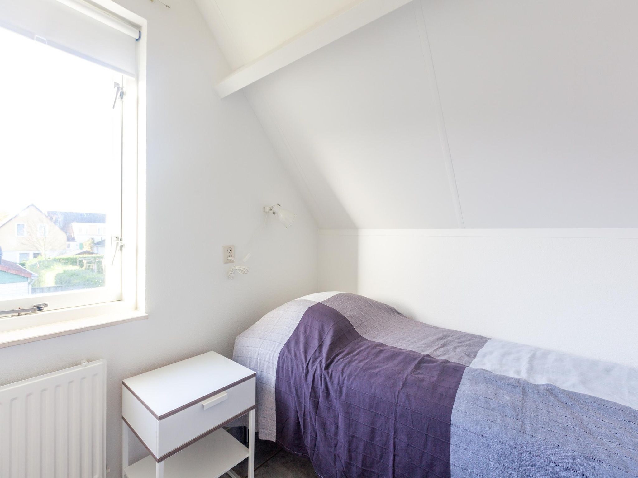 Een slaapkamer van Villapark De Oesterbaai 64 in Wemeldinge