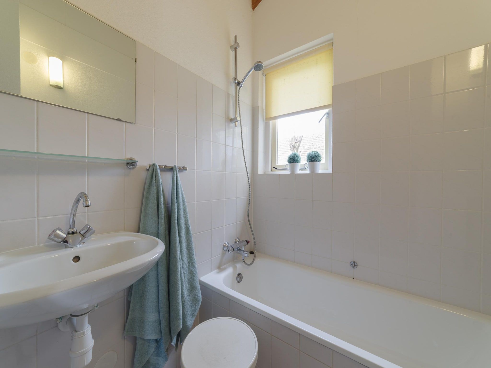 De badkamer van Villapark De Oesterbaai 70 in Wemeldinge