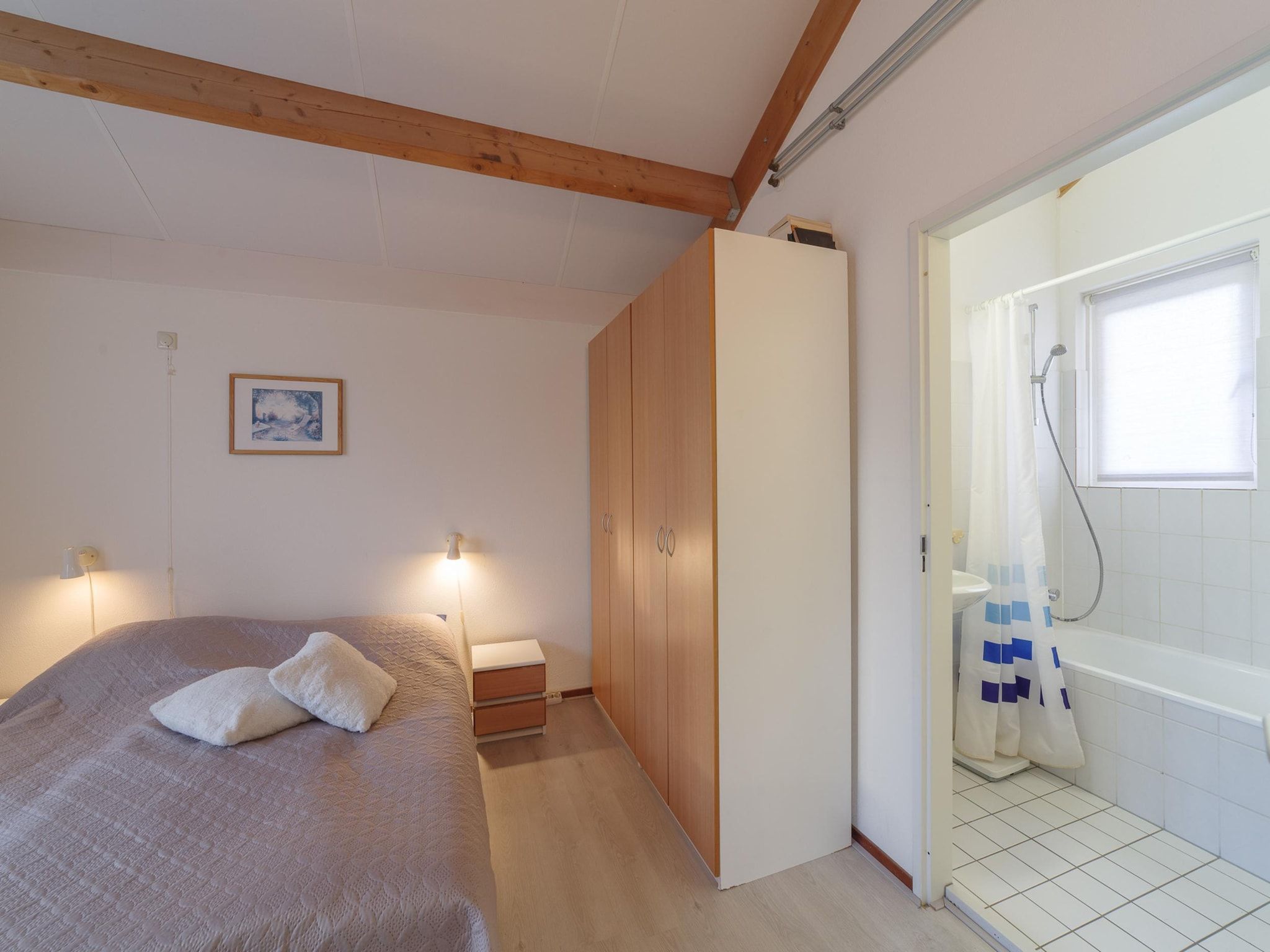 Een slaapkamer van Villapark De Oesterbaai 91 in Wemeldinge