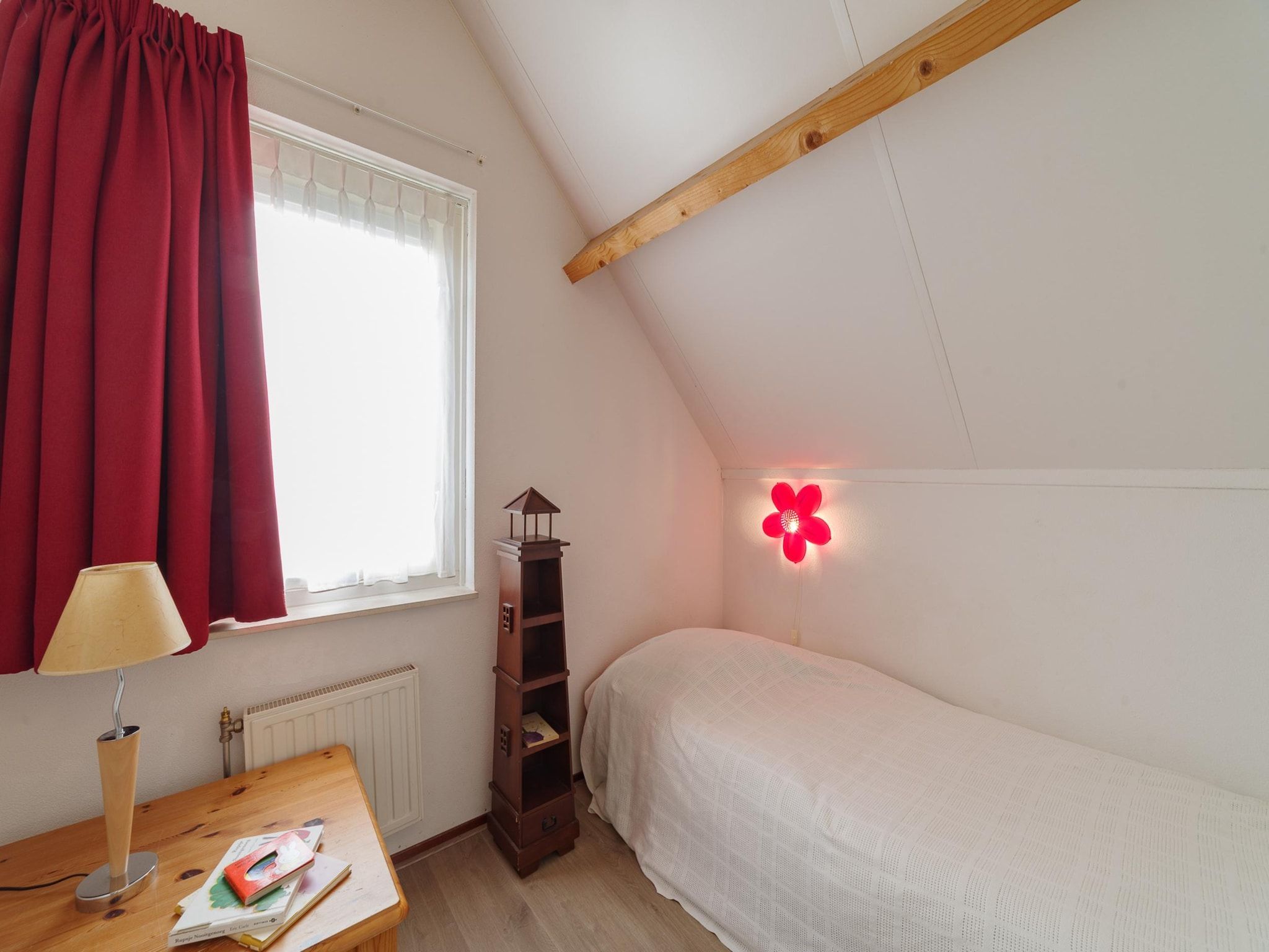 Een slaapkamer van Villapark De Oesterbaai 91 in Wemeldinge