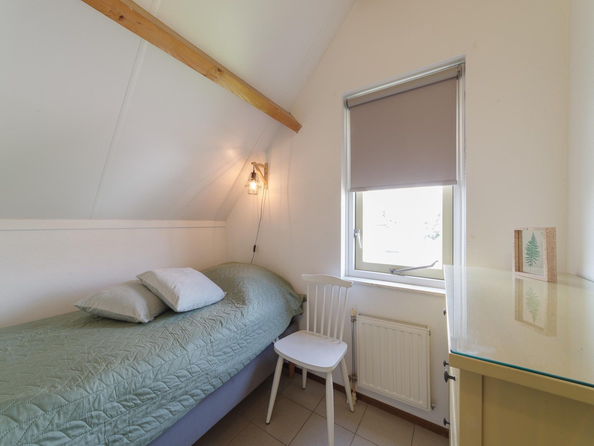 Een slaapkamer van Villapark De Oesterbaai 123 in Wemeldinge