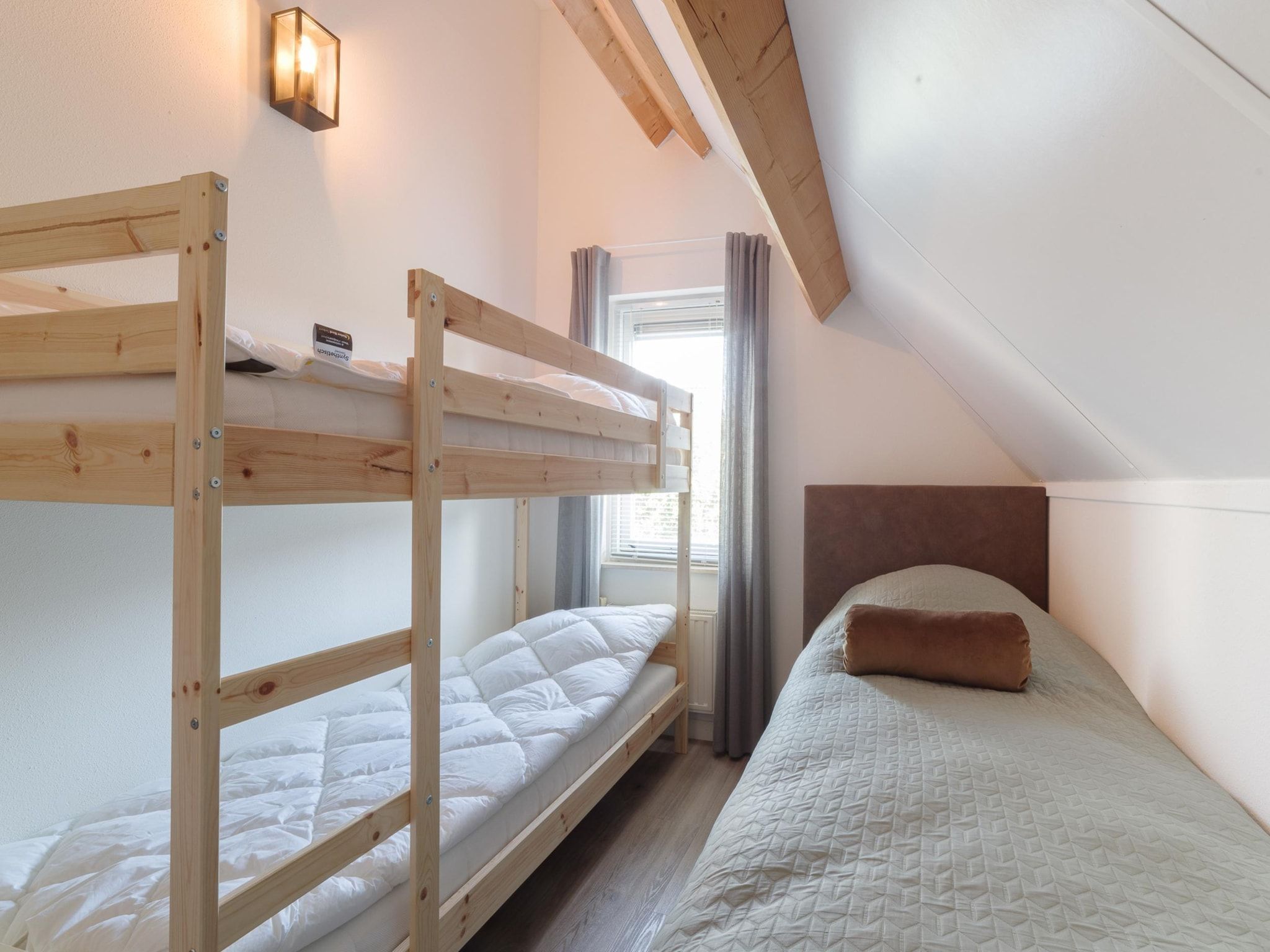 Een slaapkamer van Villapark De Oesterbaai 126 in Wemeldinge