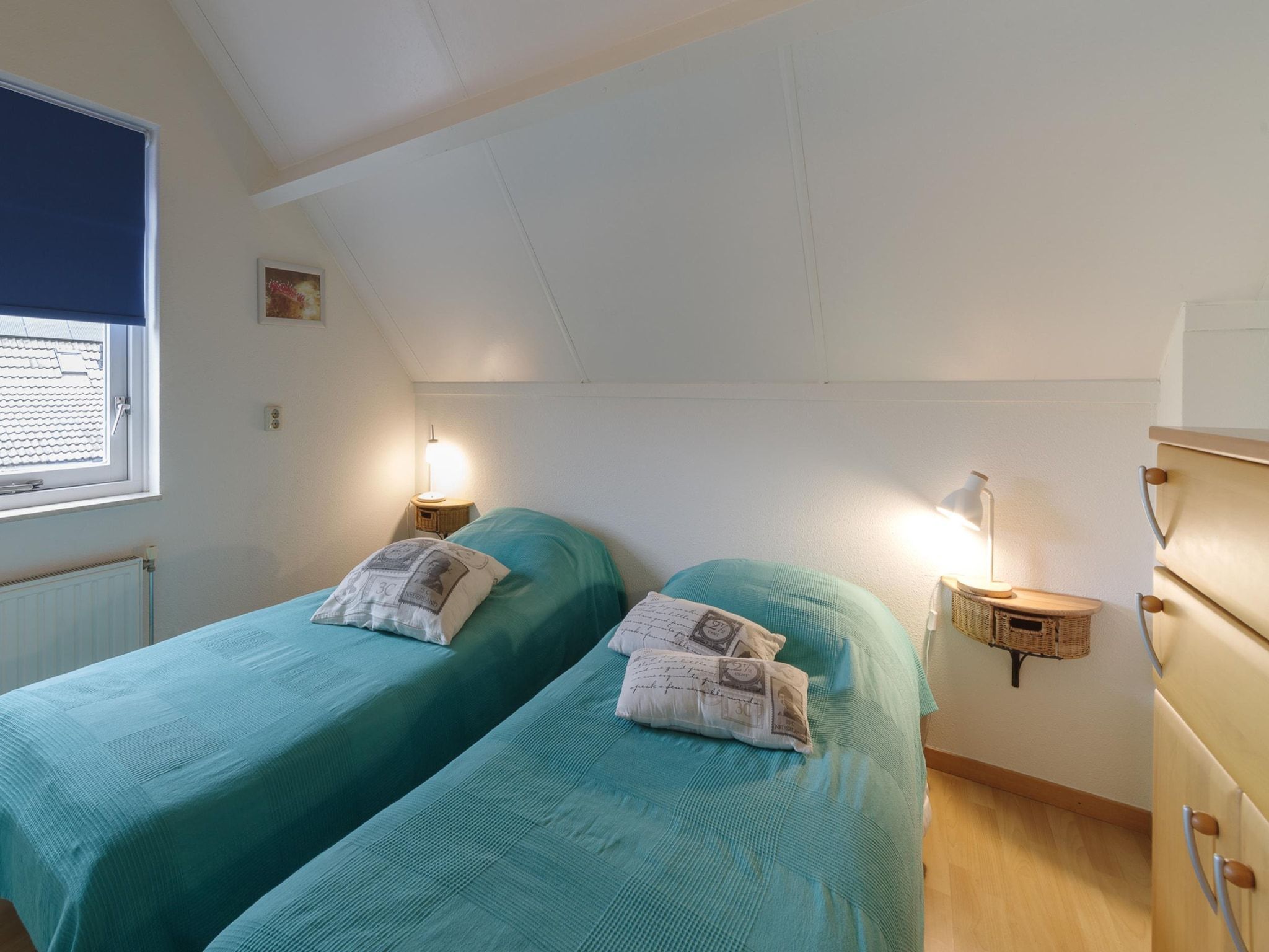 Een slaapkamer van Villapark De Oesterbaai 131 in Wemeldinge