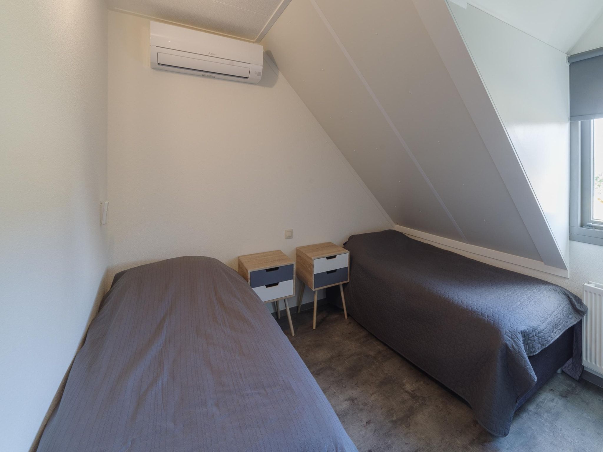 Een slaapkamer van Villapark De Oesterbaai 137 in Wemeldinge