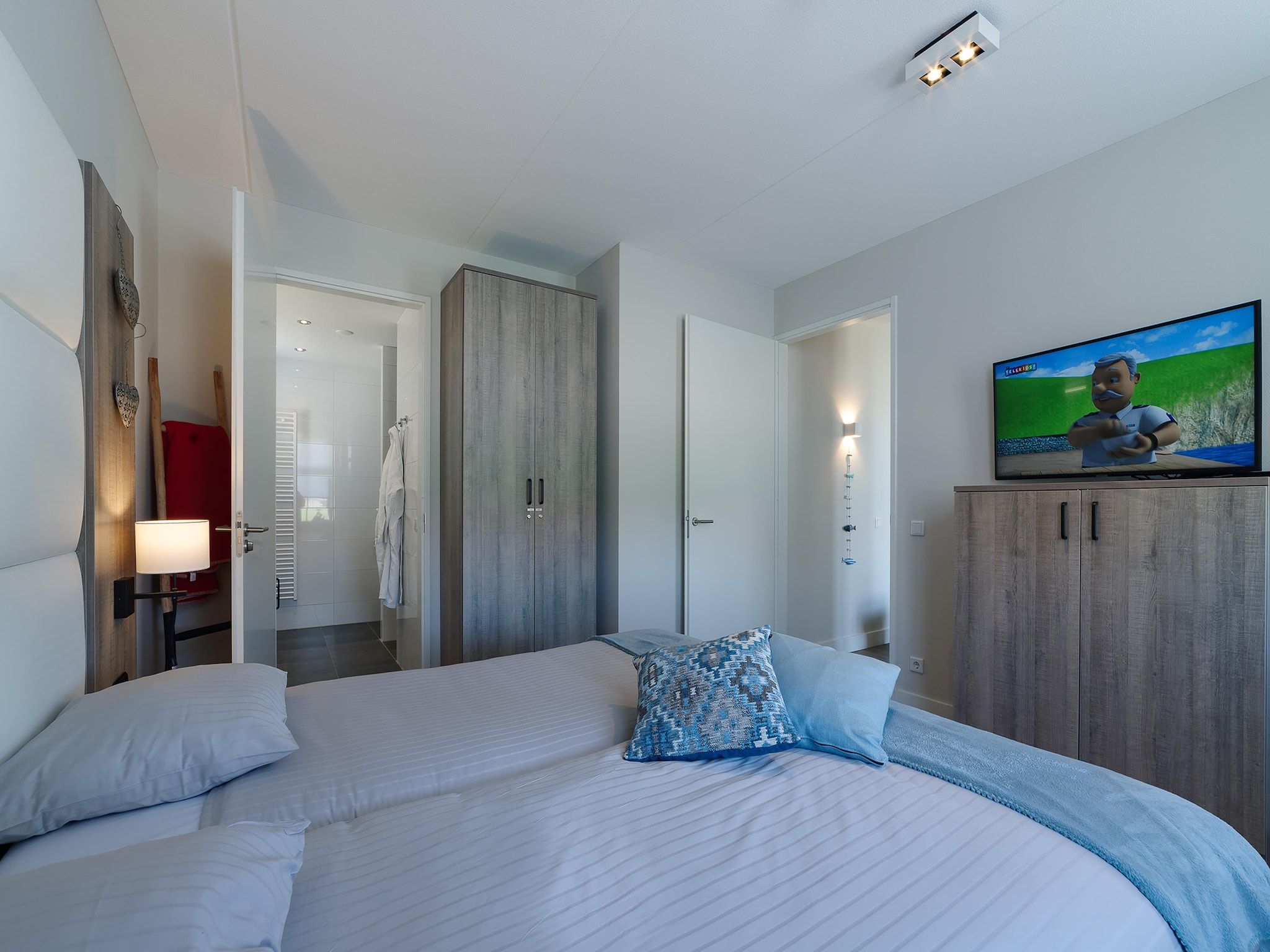 Een slaapkamer van Game Villa in Colijnsplaat