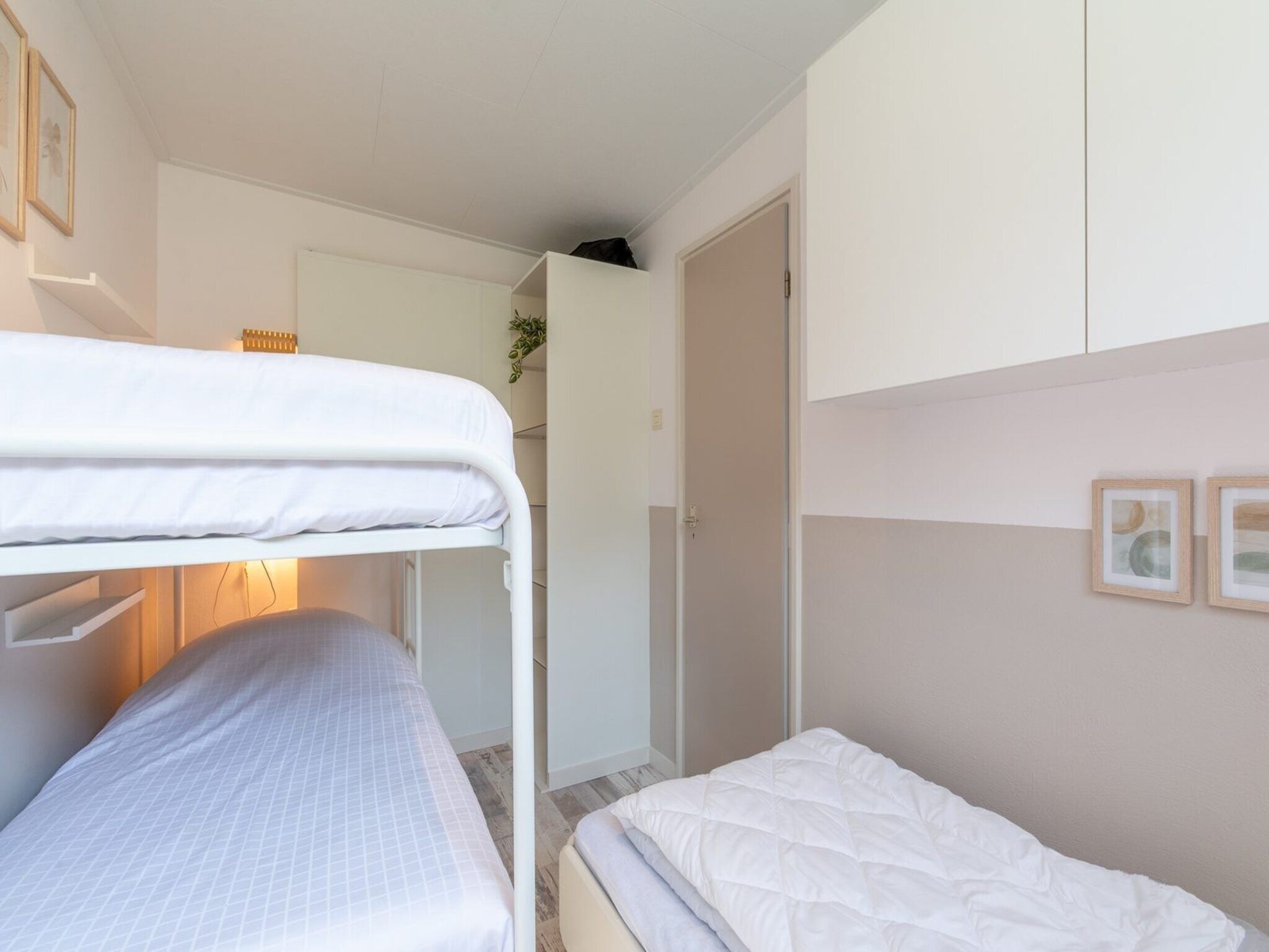 Een slaapkamer van Duinland 188 in Sint Maartenszee