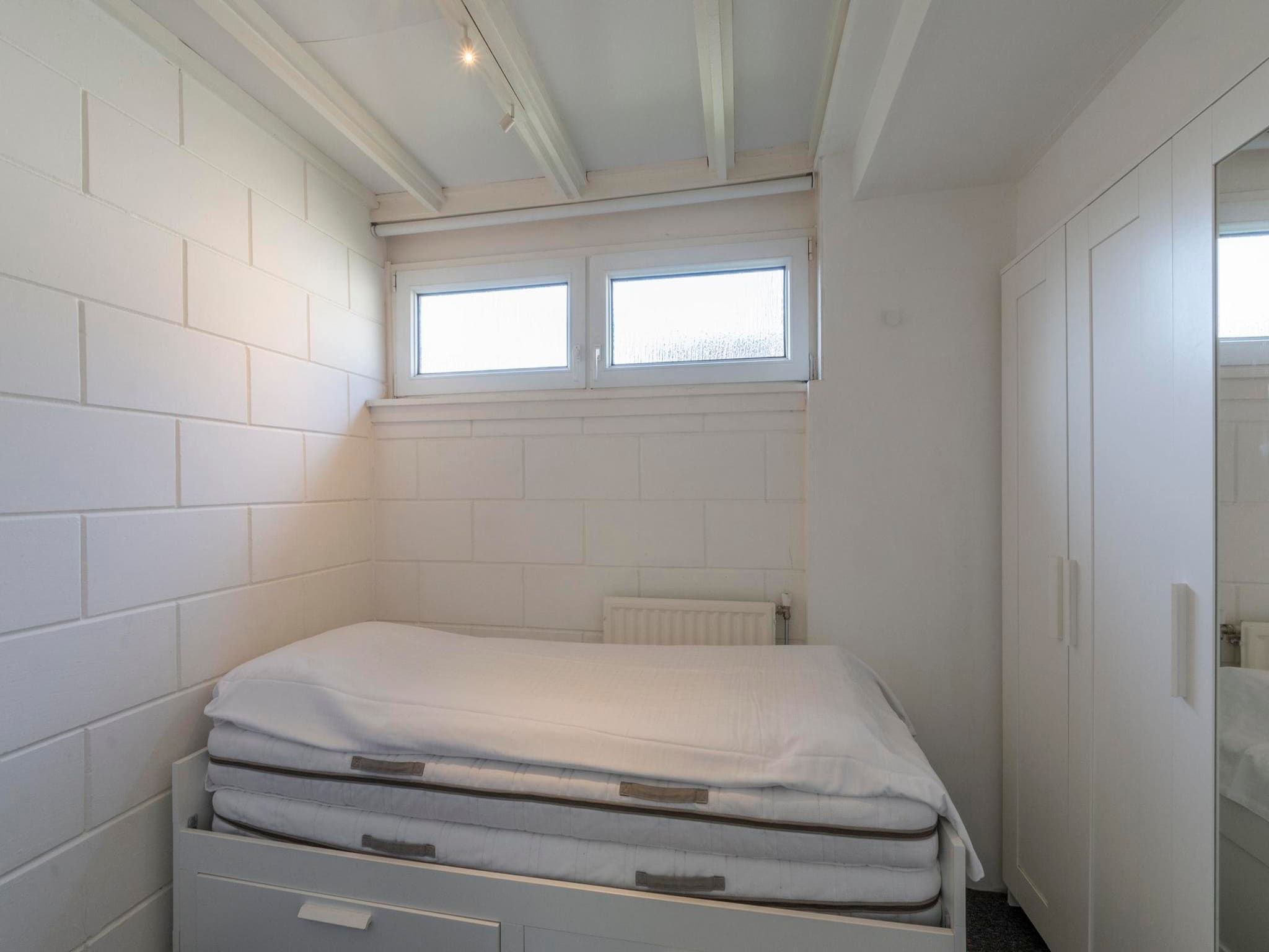 Een slaapkamer van Duinland 21 in Sint Maartenszee