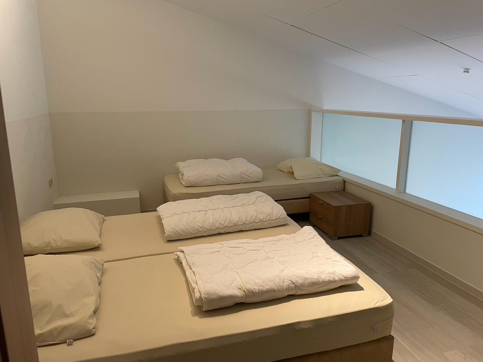 Een slaapkamer van Het Platte Putje - Huisdier - nr 2 in Groede