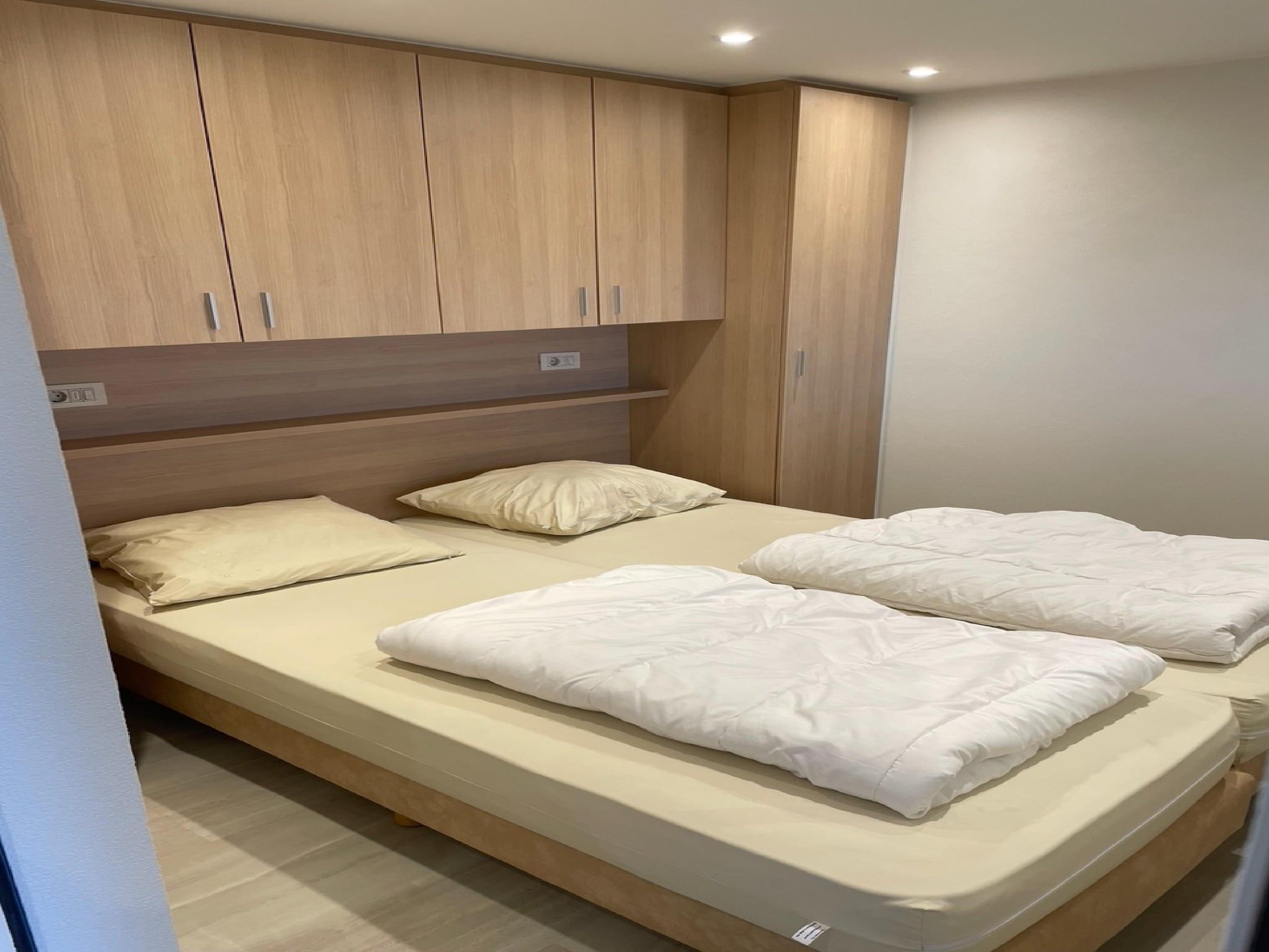 Een slaapkamer van Het Platte Putje - Huisdier - nr 2 in Groede
