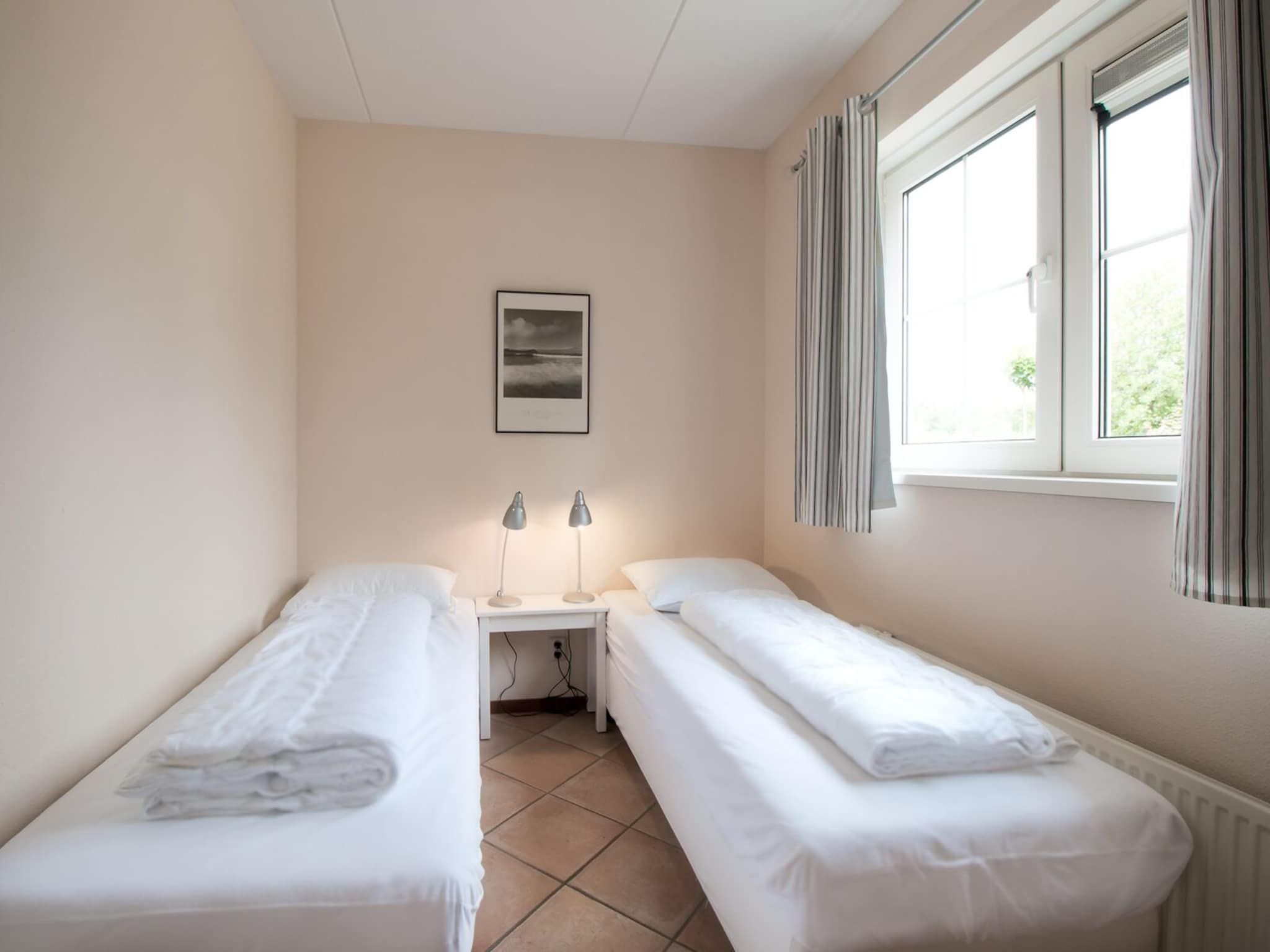 Een slaapkamer van Anzelhoef 5 in Sint Maartenszee