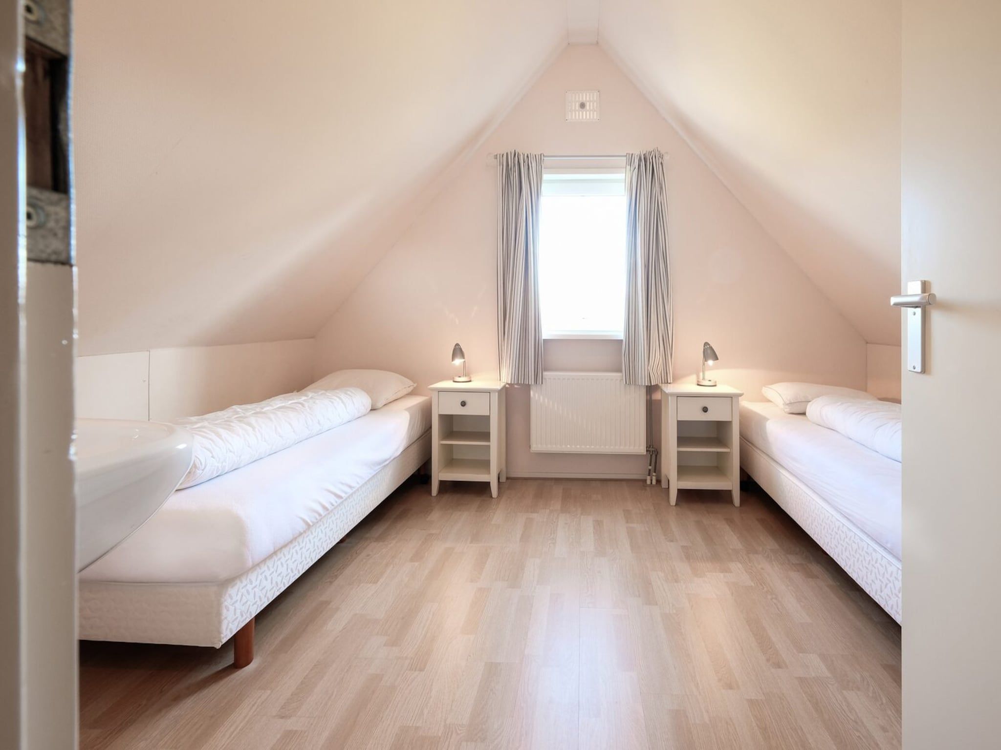 Een slaapkamer van Anzelhoef 5 in Sint Maartenszee