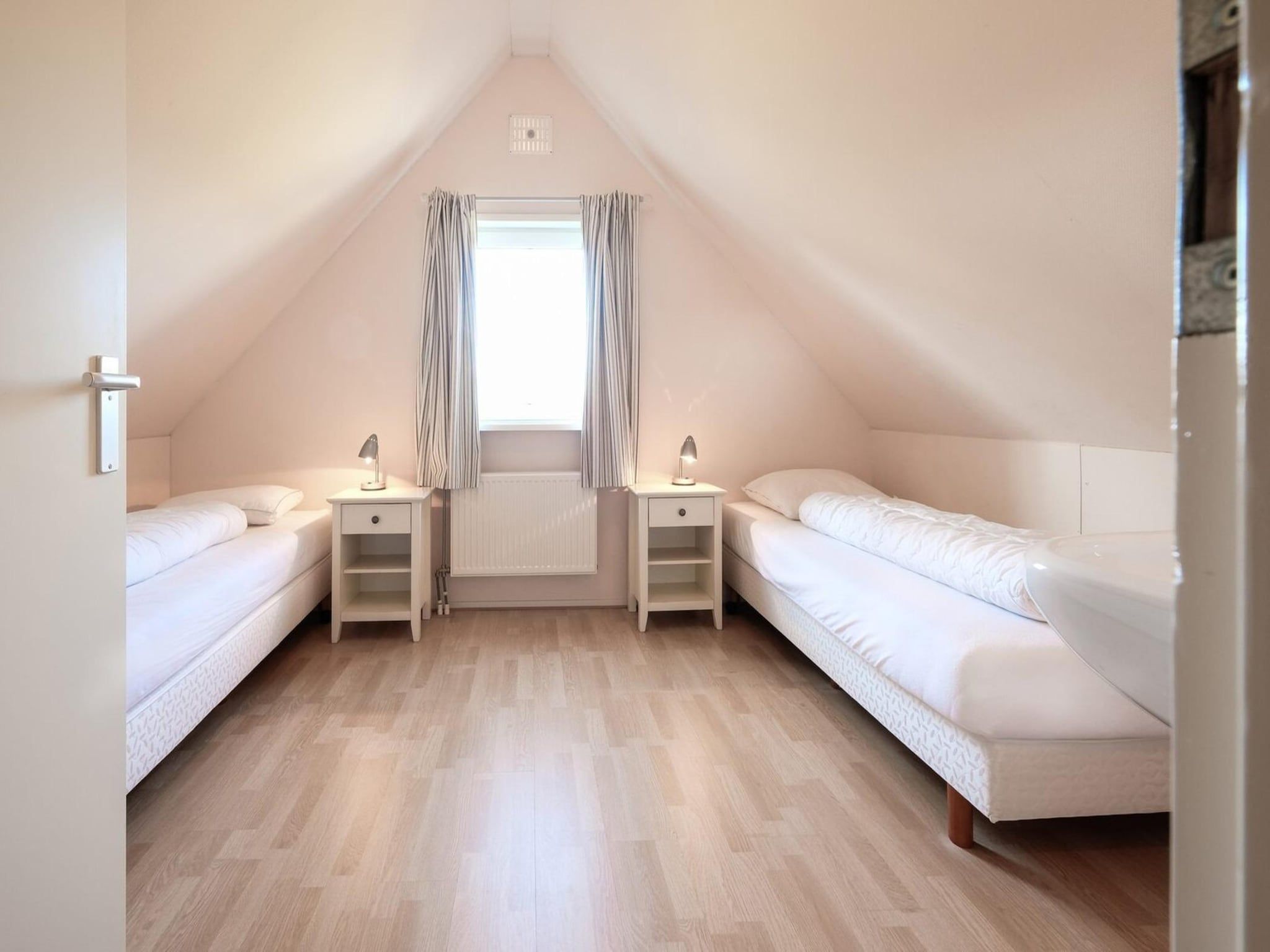 Een slaapkamer van Anzelhoef 5 in Sint Maartenszee