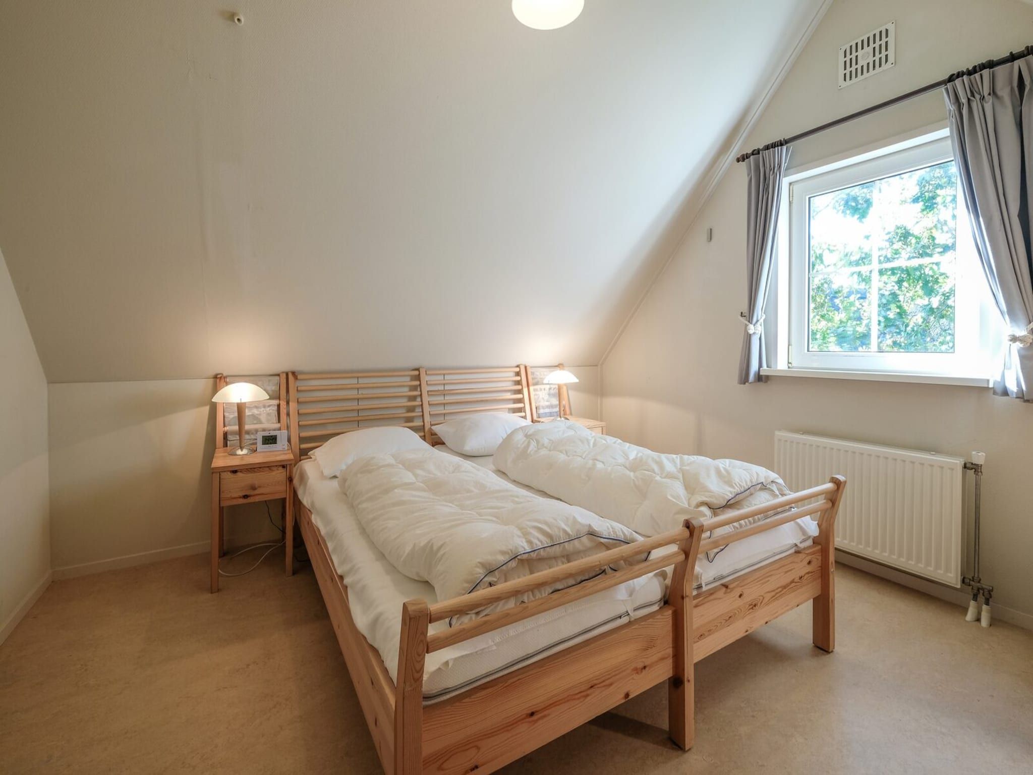 Een slaapkamer van Anzelhoef 8 in Sint Maartenszee