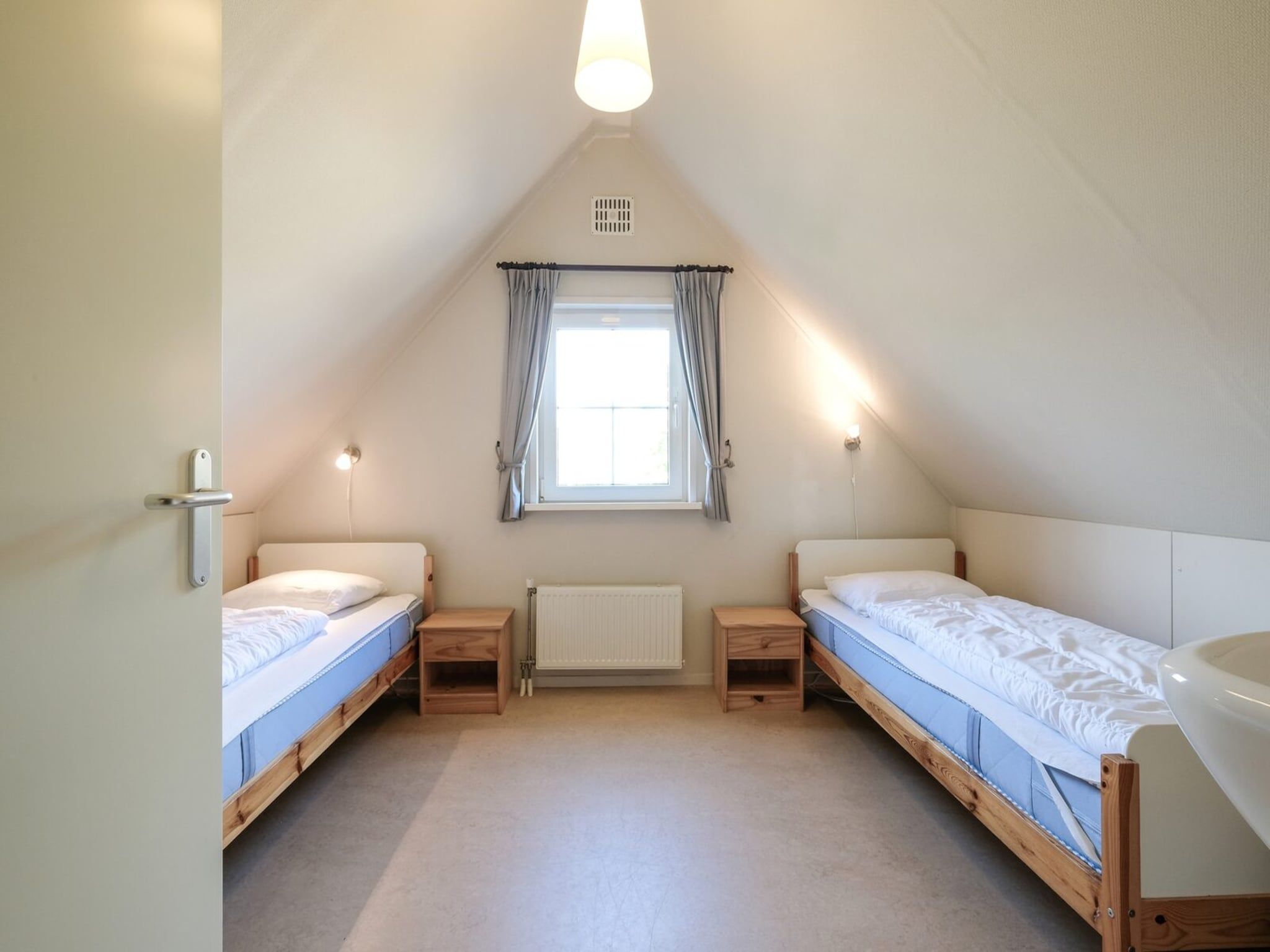 Een slaapkamer van Anzelhoef 8 in Sint Maartenszee