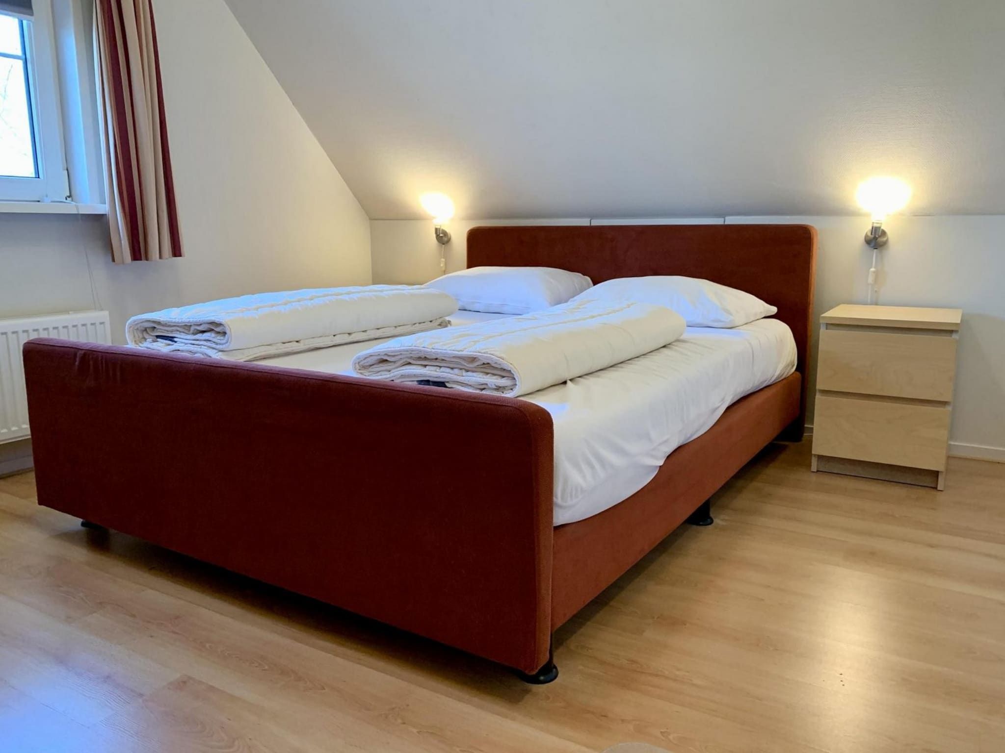 Een slaapkamer van Anzelhoef 25 in Sint Maartenszee