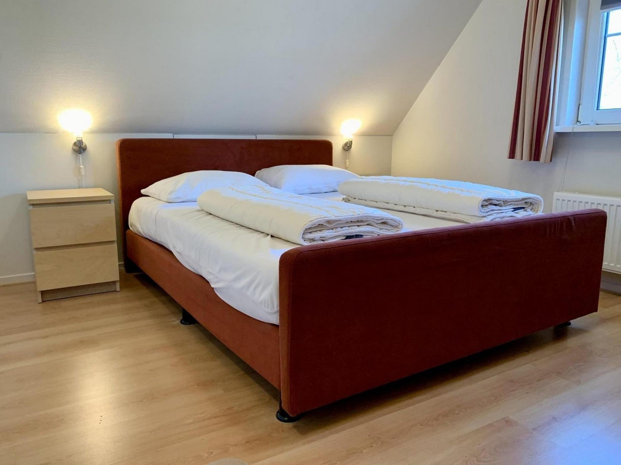 Een slaapkamer van Anzelhoef 25 in Sint Maartenszee