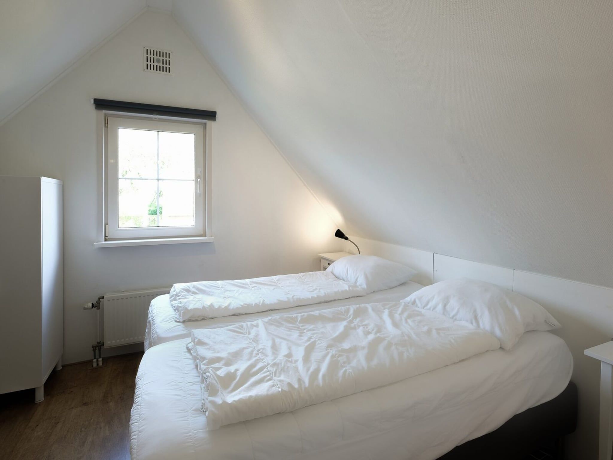 Een slaapkamer van Anzelhoef 30 in Sint Maartenszee