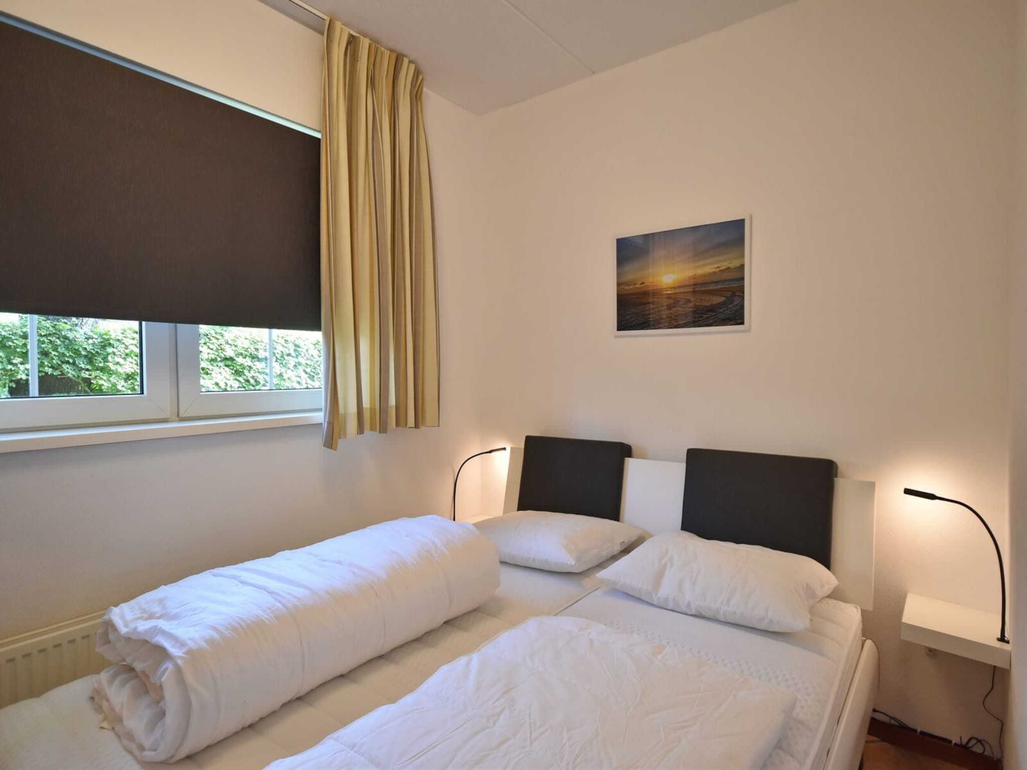 Een slaapkamer van Anzelhoef 11 in Sint Maartenszee