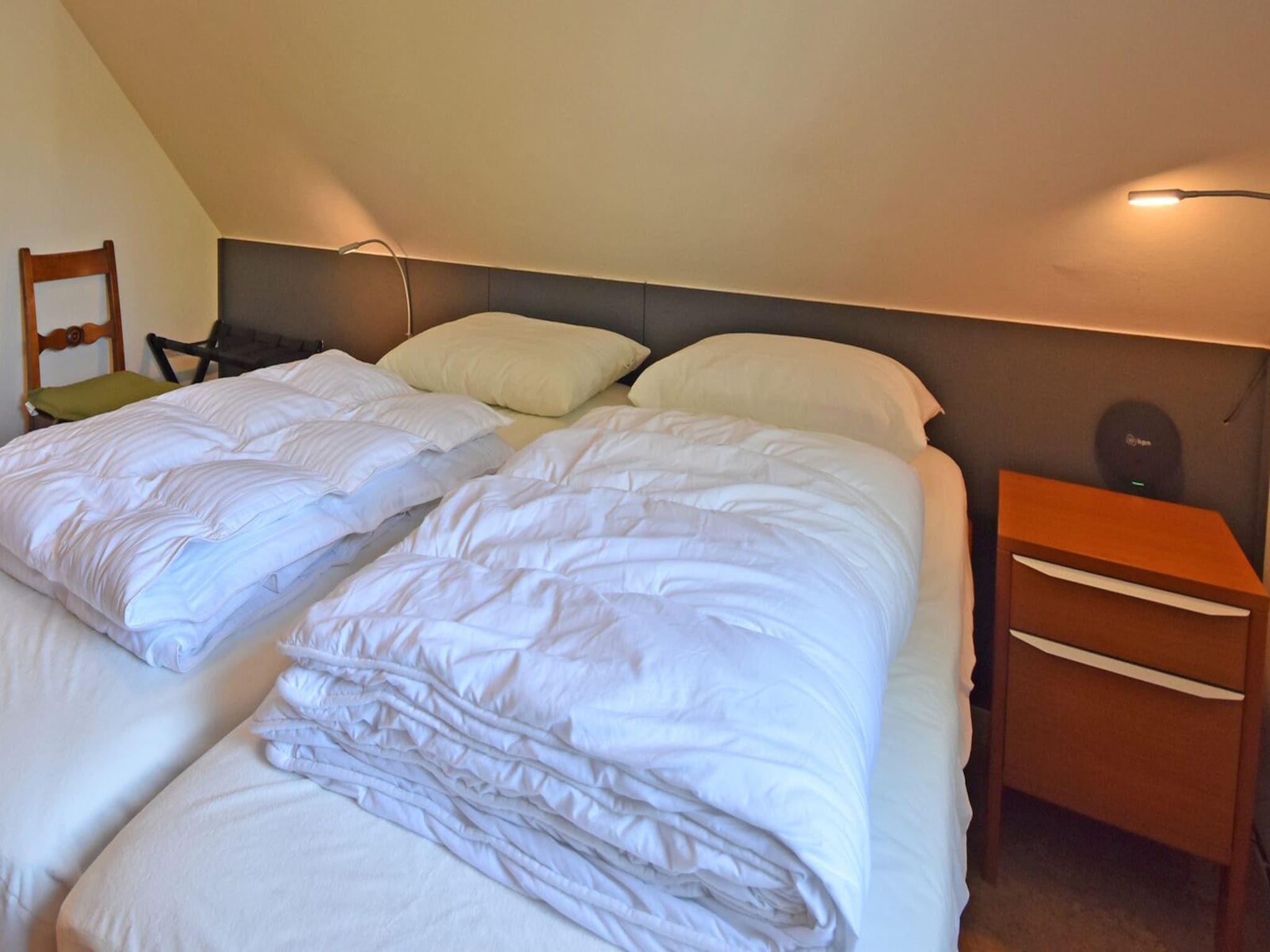Een slaapkamer van Anzelhoef 11 in Sint Maartenszee