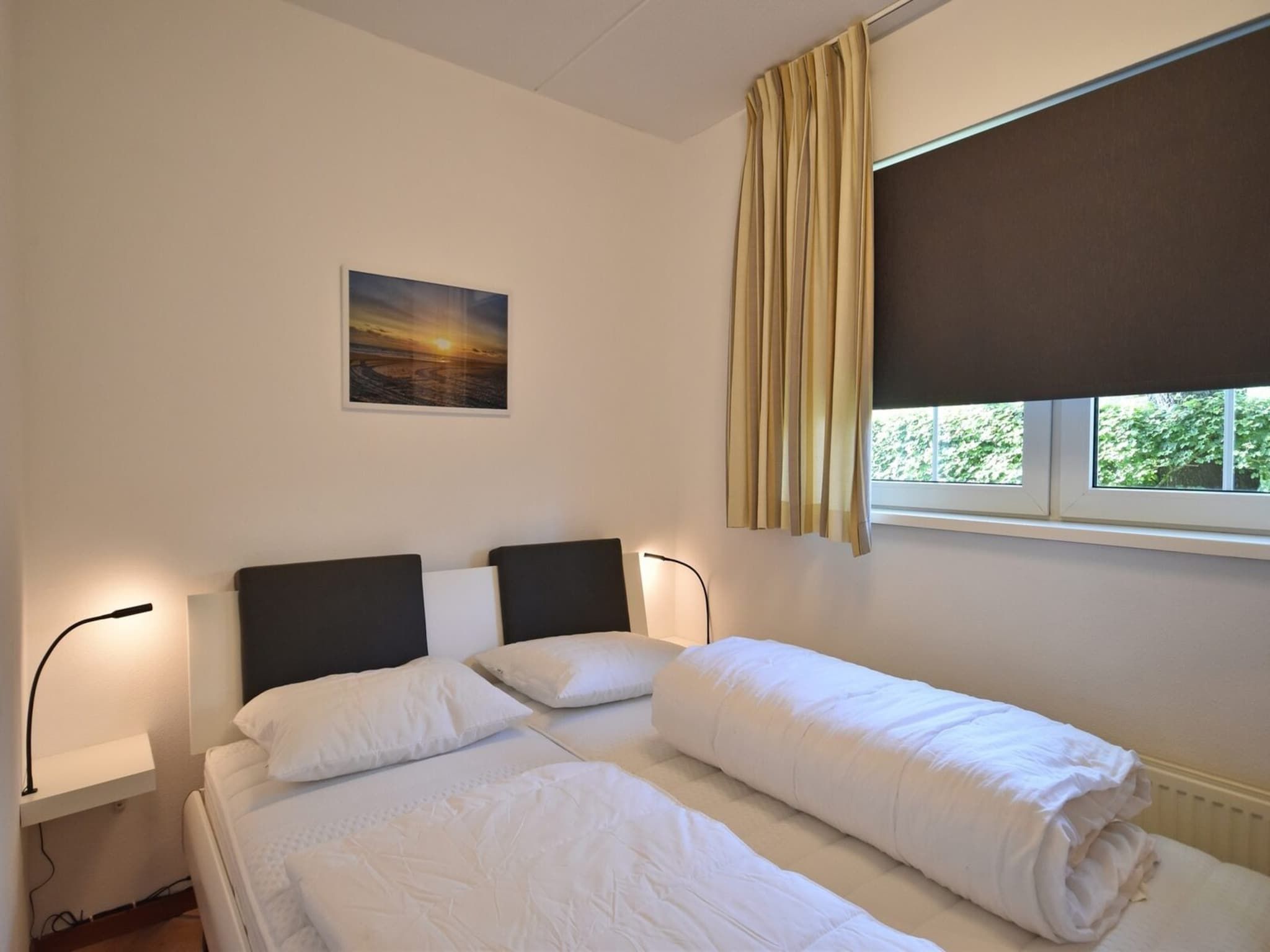 Een slaapkamer van Anzelhoef 11 in Sint Maartenszee