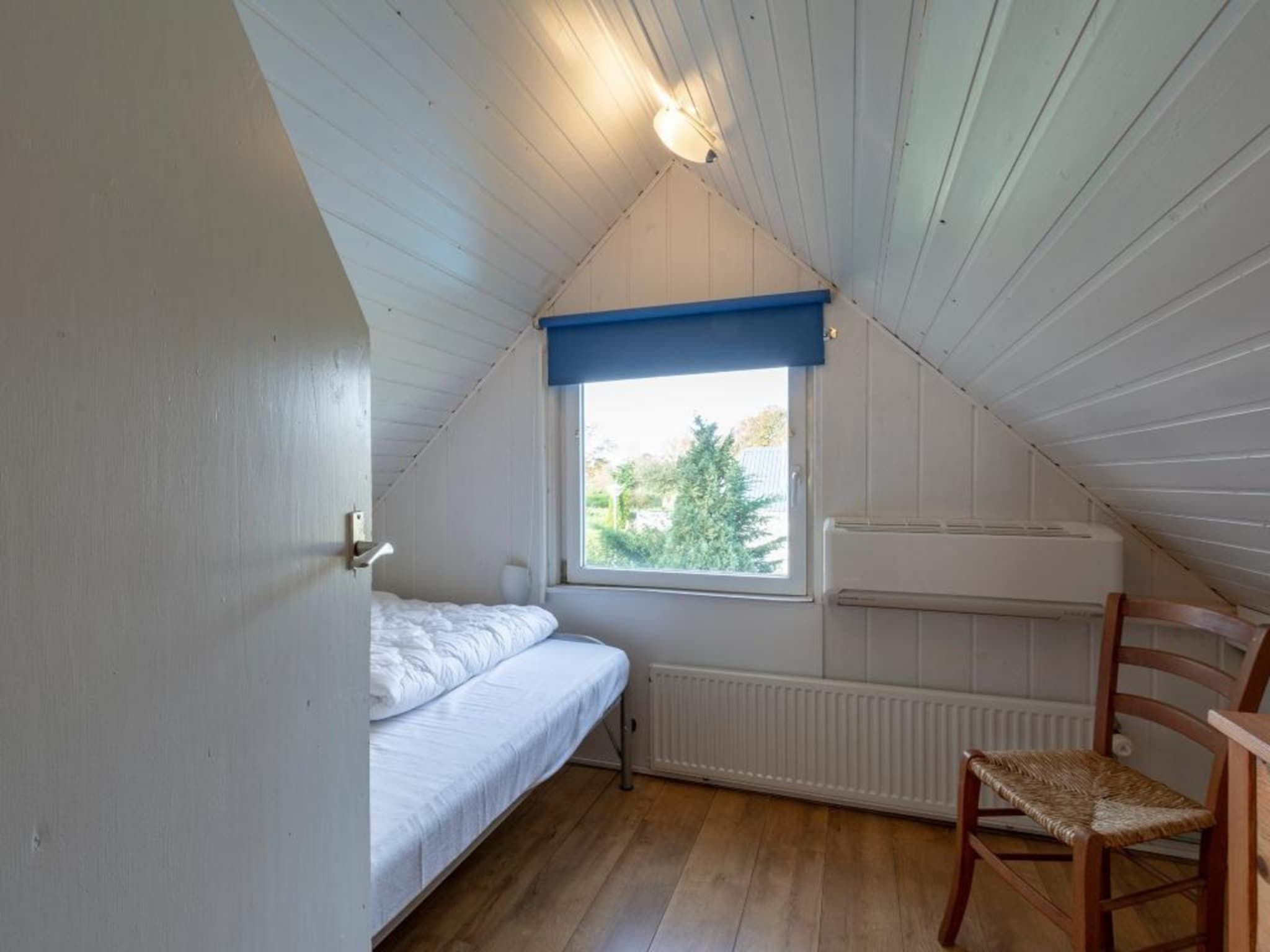 Een slaapkamer van Belkmerduinen 03 in Sint Maartenszee