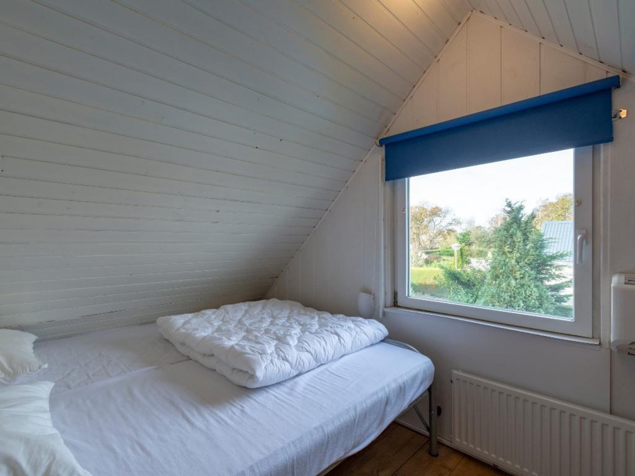 Een slaapkamer van Belkmerduinen 03 in Sint Maartenszee