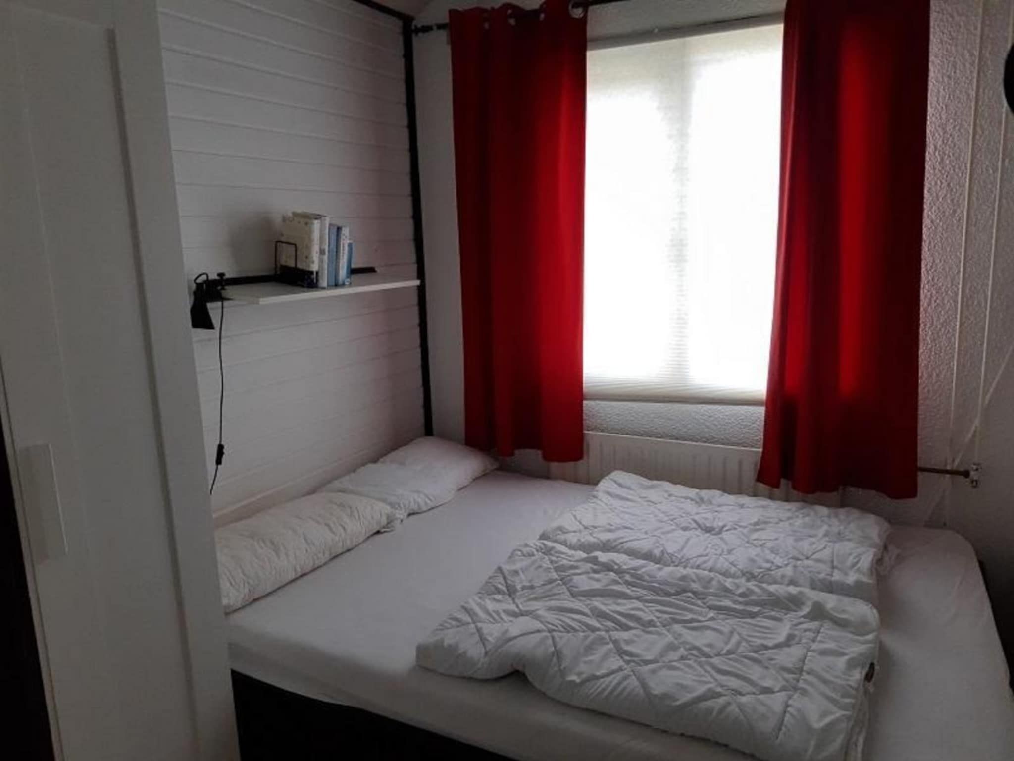 Een slaapkamer van Belkmerduinen 23 in Sint Maartenszee