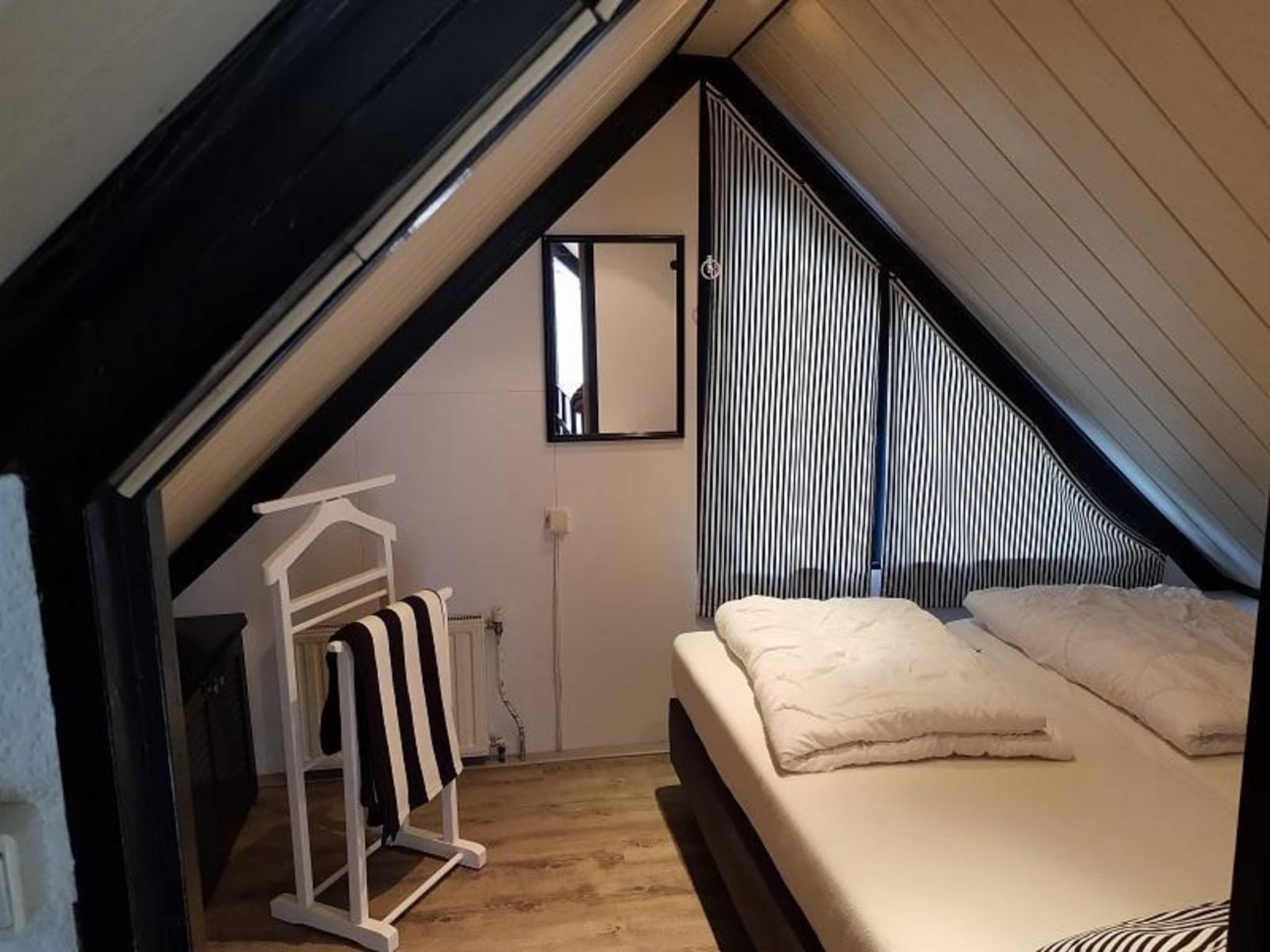 Een slaapkamer van Belkmerduinen 23 in Sint Maartenszee