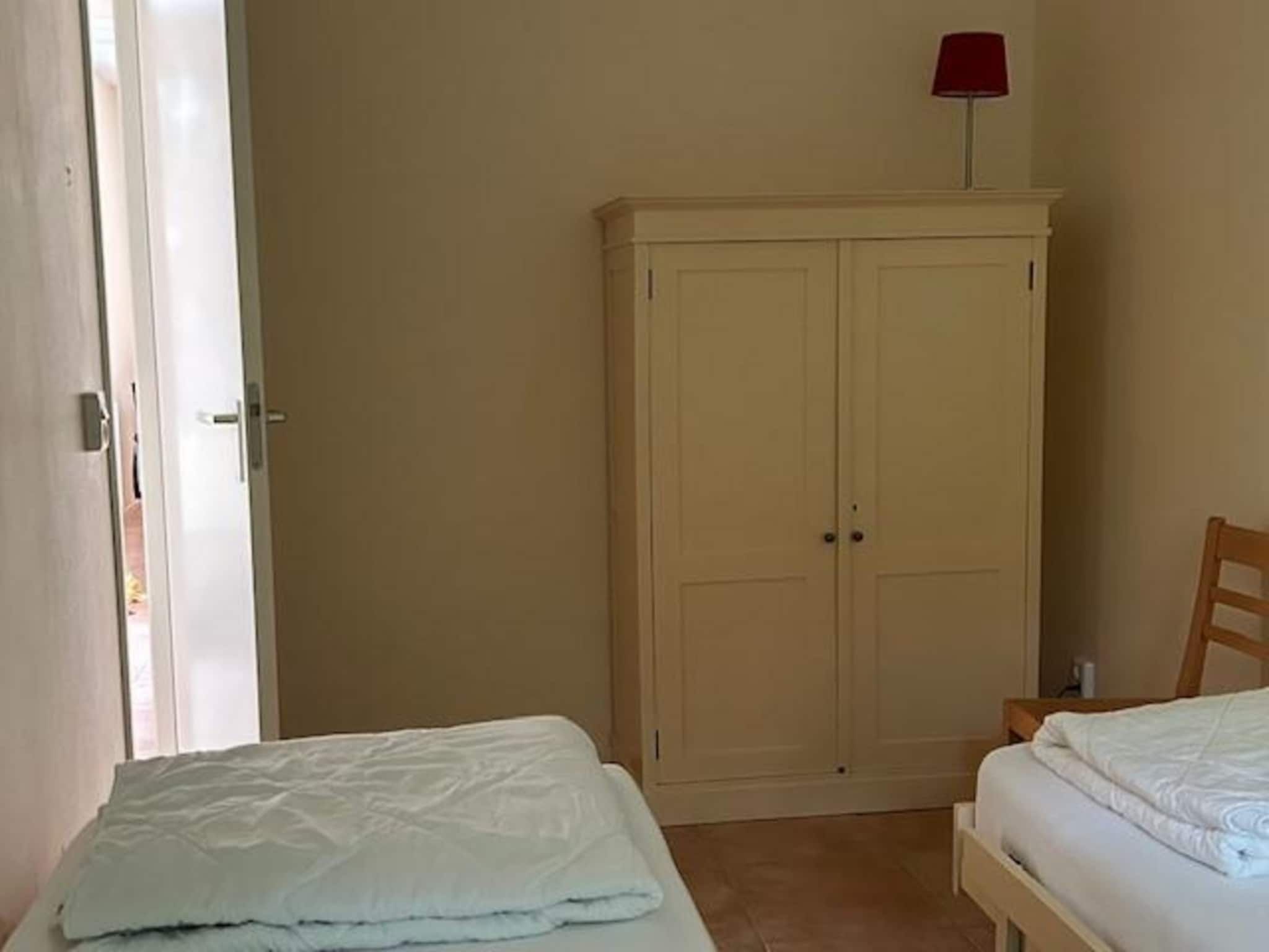 Een slaapkamer van Campanula 11 in Sint Maartenszee