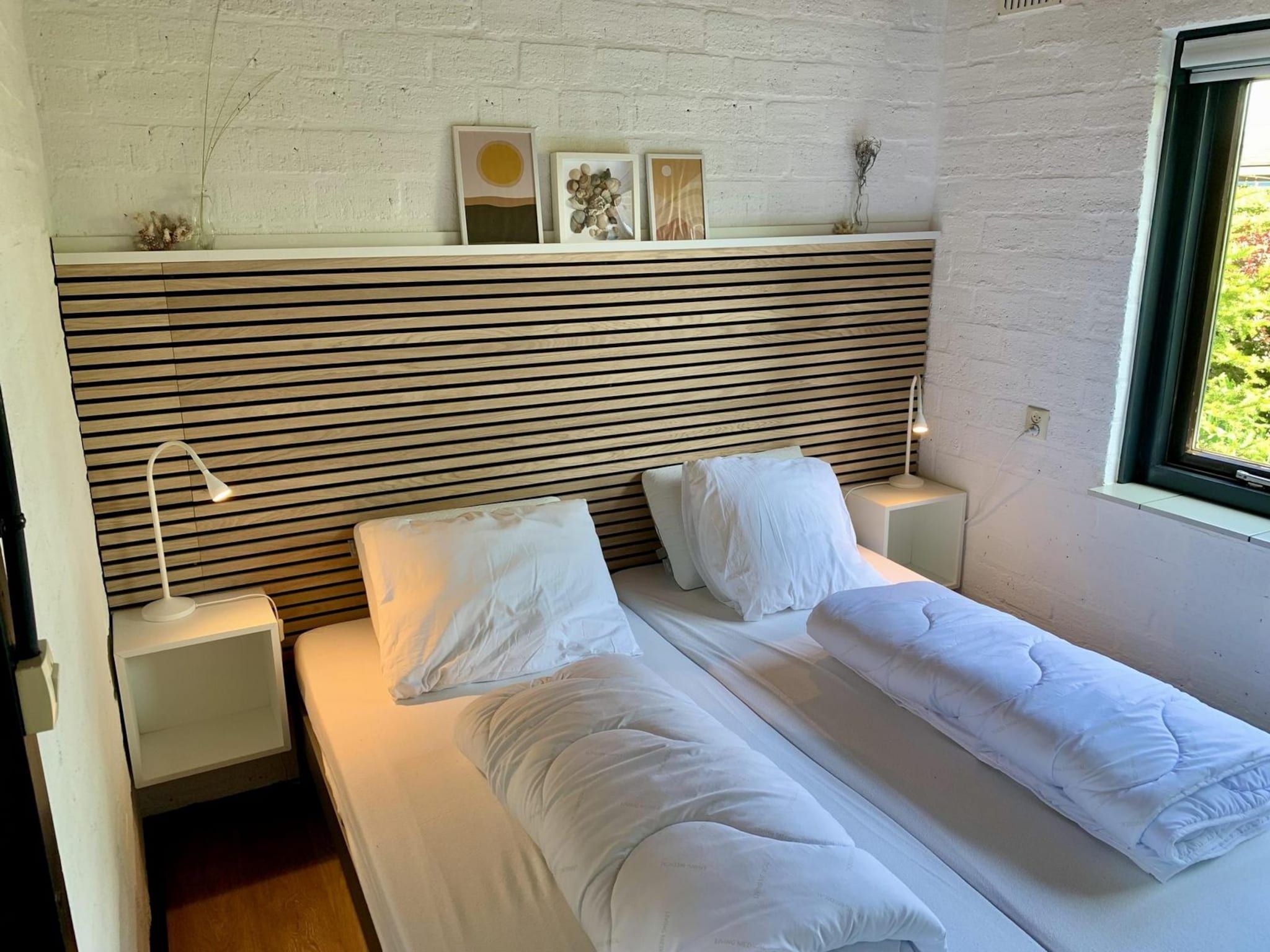 Een slaapkamer van Boerenslag 23 in Sint Maartenszee