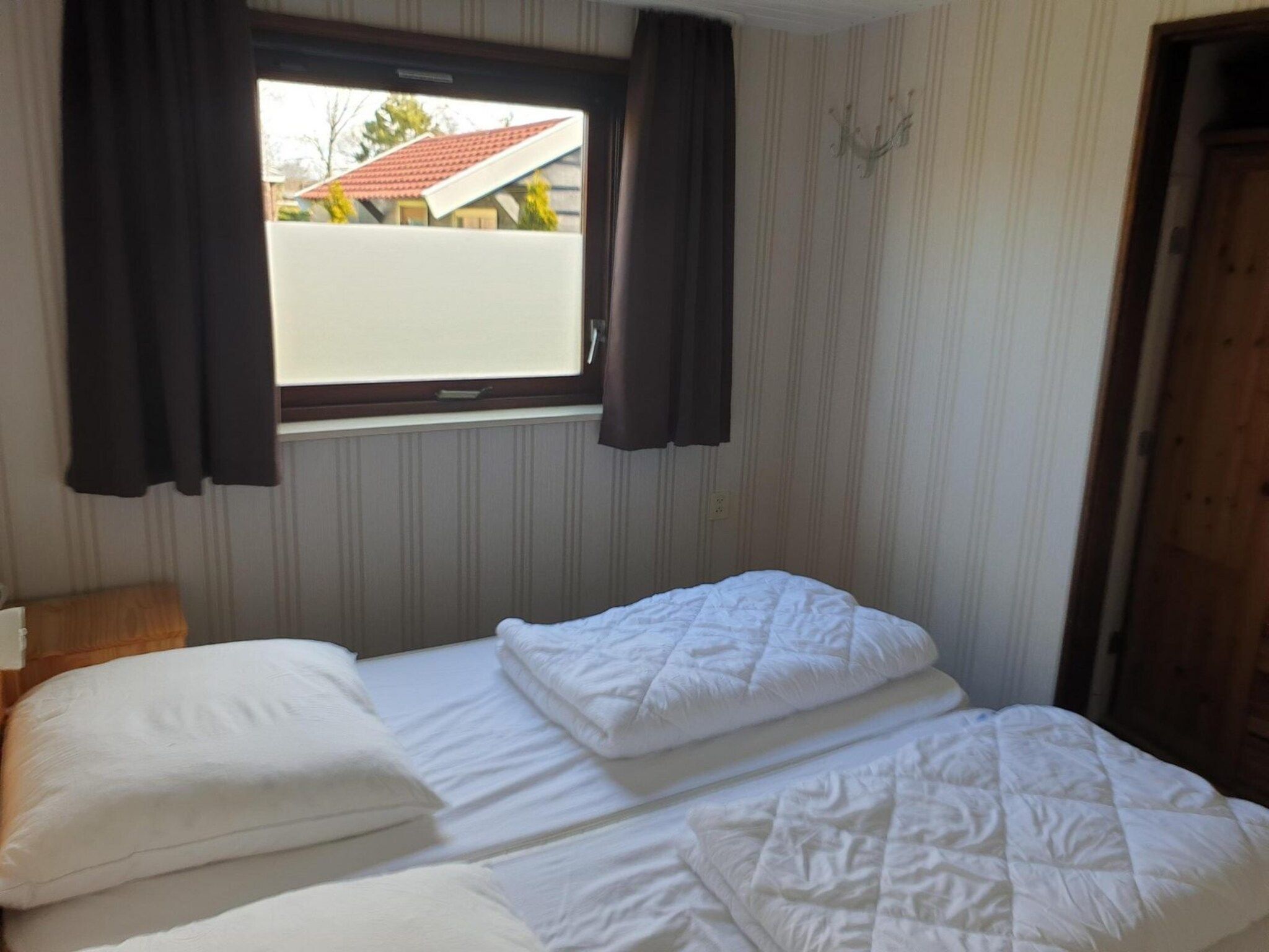 Een slaapkamer van Eureka 9 in Sint Maartenszee