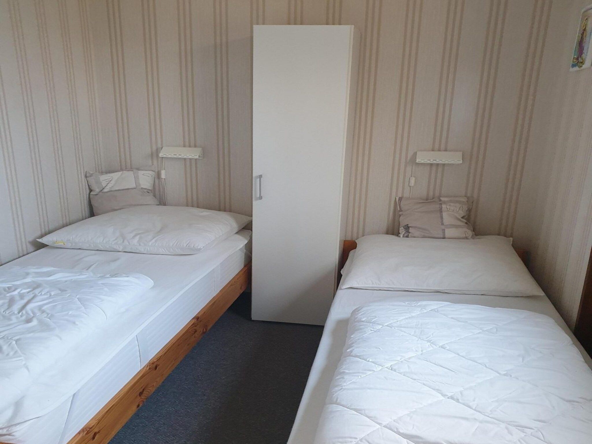 Een slaapkamer van Eureka 9 in Sint Maartenszee