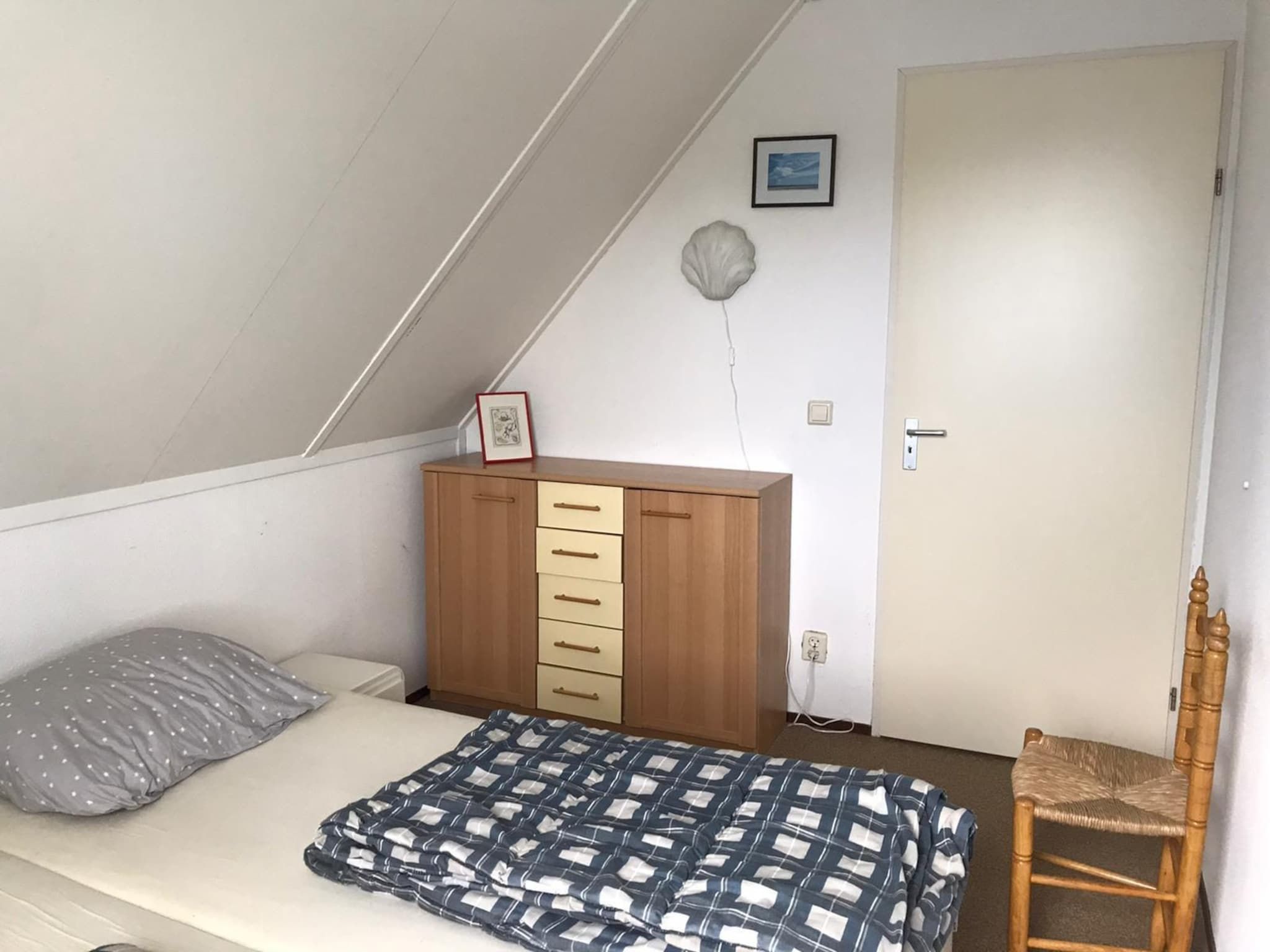 Een slaapkamer van Bohemien 27 in Sint Maartenszee