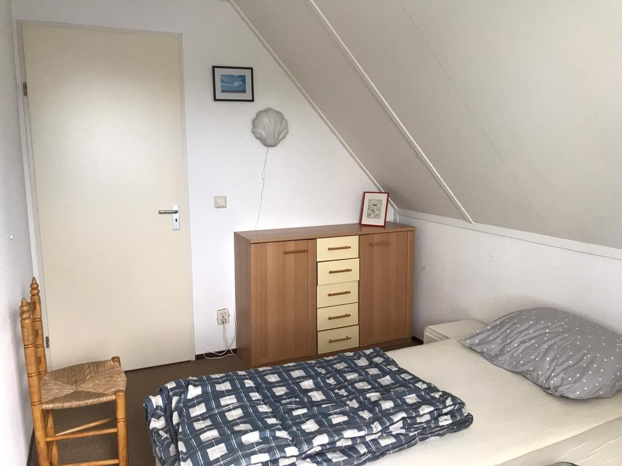 Een slaapkamer van Bohemien 27 in Sint Maartenszee