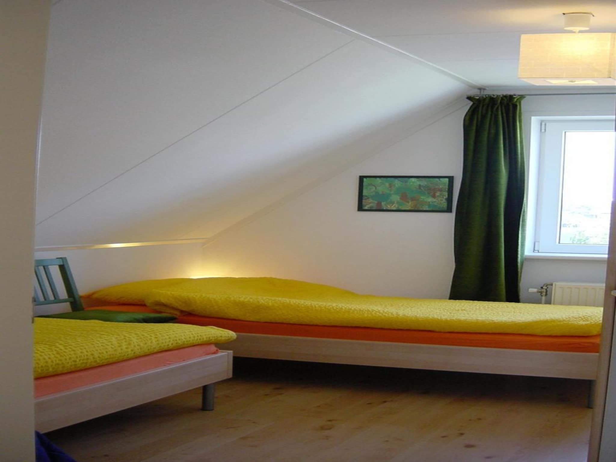 Een slaapkamer van Bohemien 38 in Sint Maartenszee