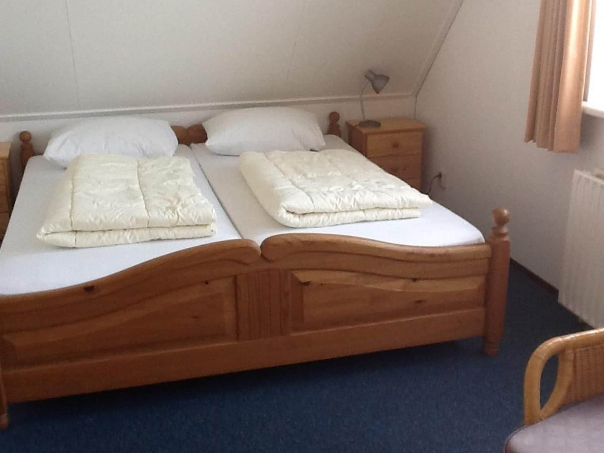 Een slaapkamer van Bohemien 40 in Sint Maartenszee