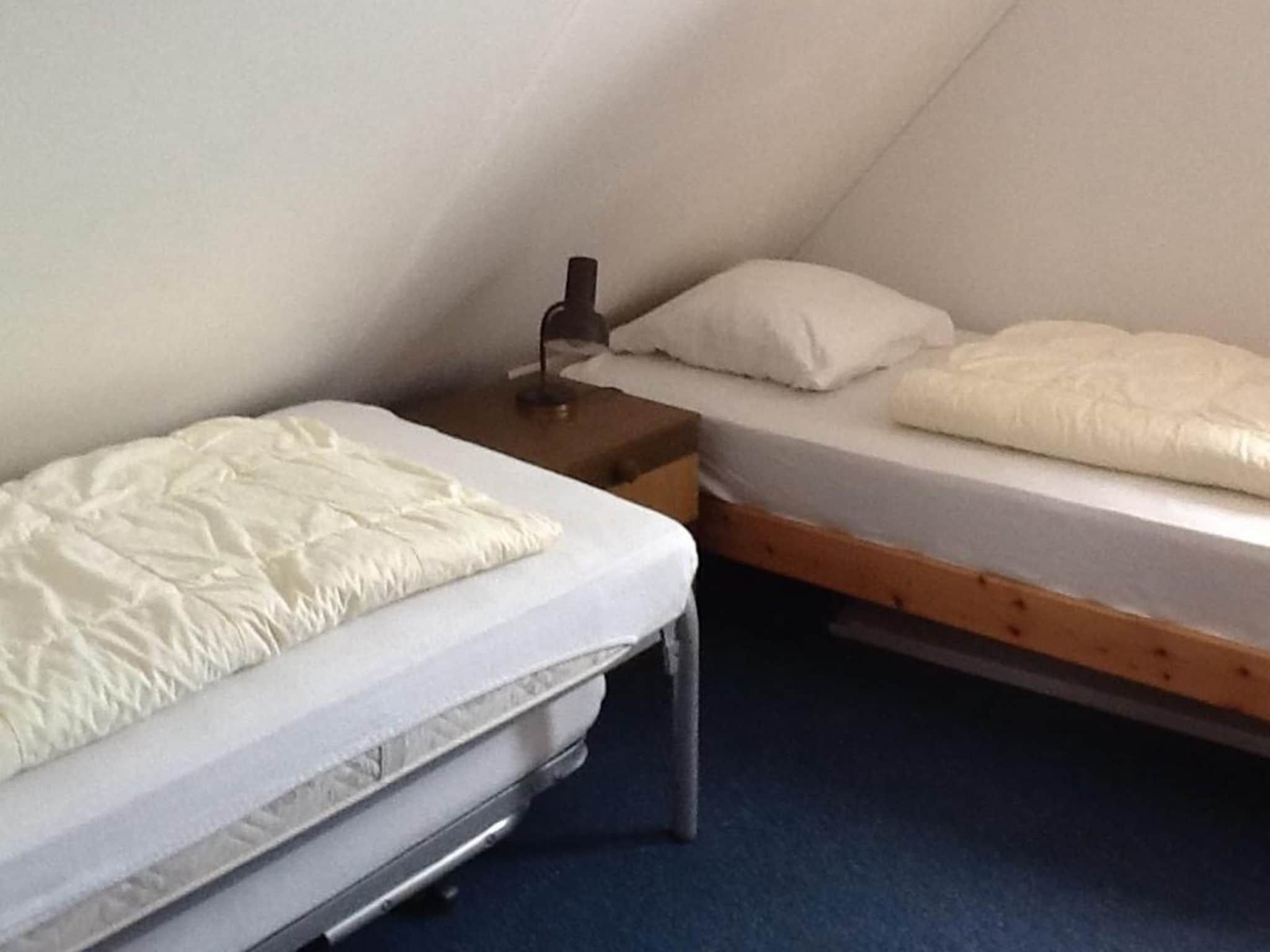 Een slaapkamer van Bohemien 40 in Sint Maartenszee
