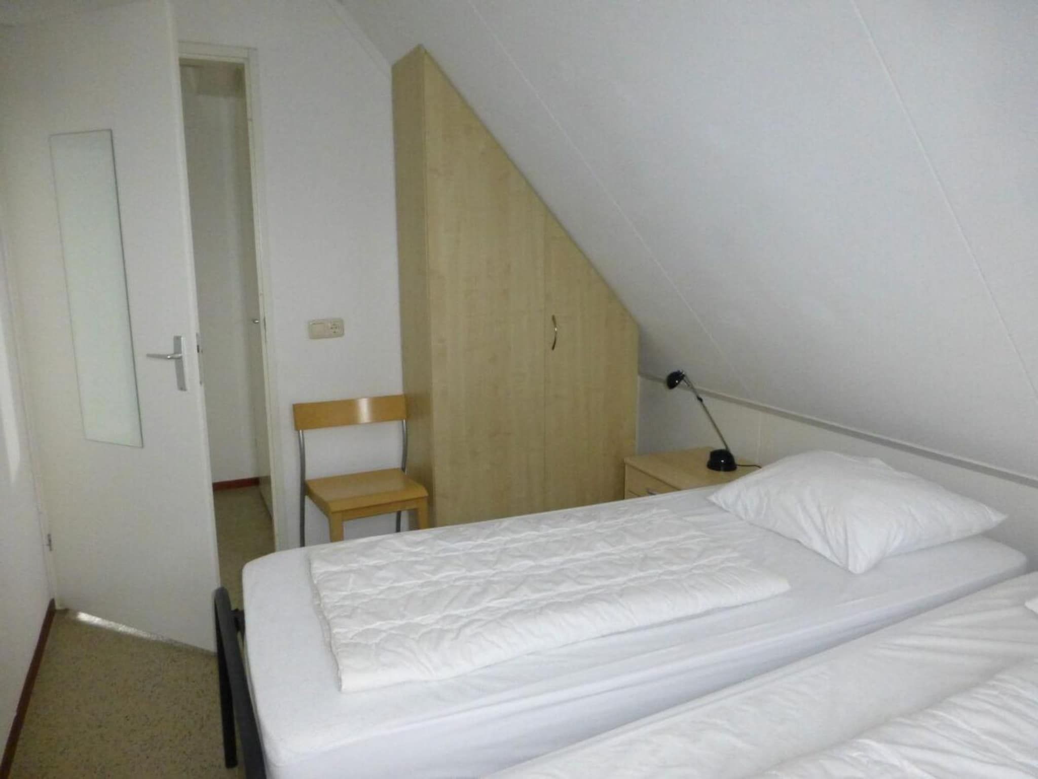 Een slaapkamer van Bohemien 47 in Sint Maartenszee