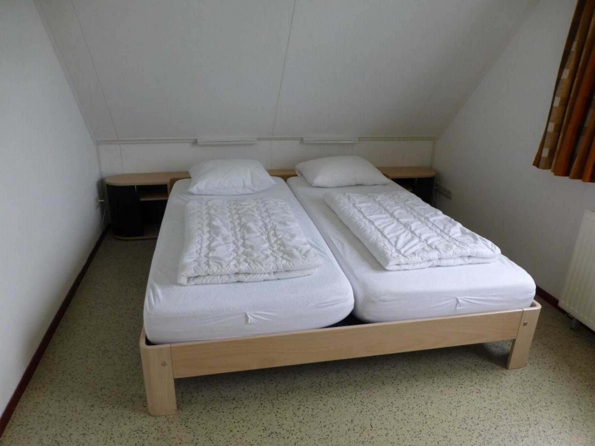 Een slaapkamer van Bohemien 47 in Sint Maartenszee