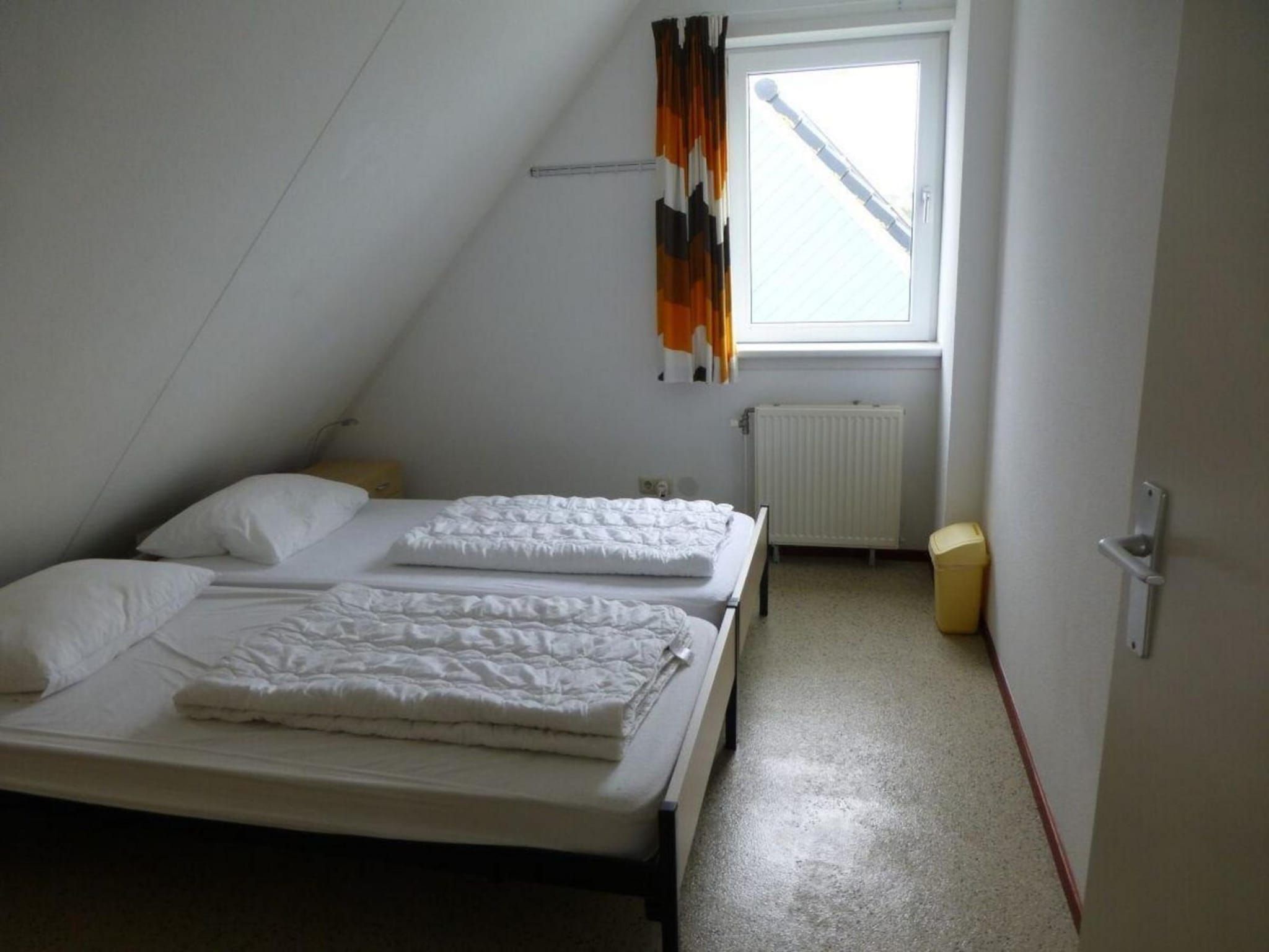 Een slaapkamer van Bohemien 47 in Sint Maartenszee