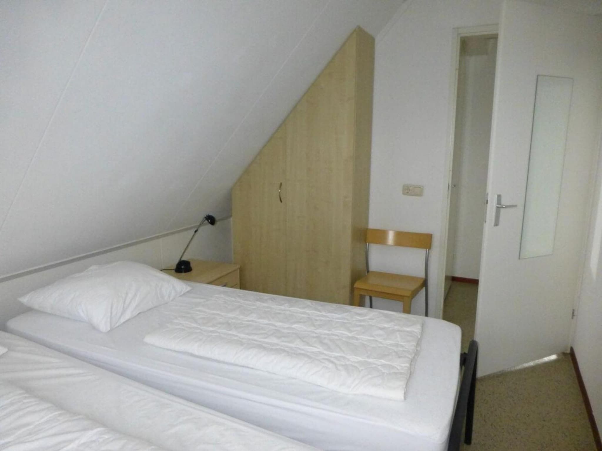 Een slaapkamer van Bohemien 47 in Sint Maartenszee