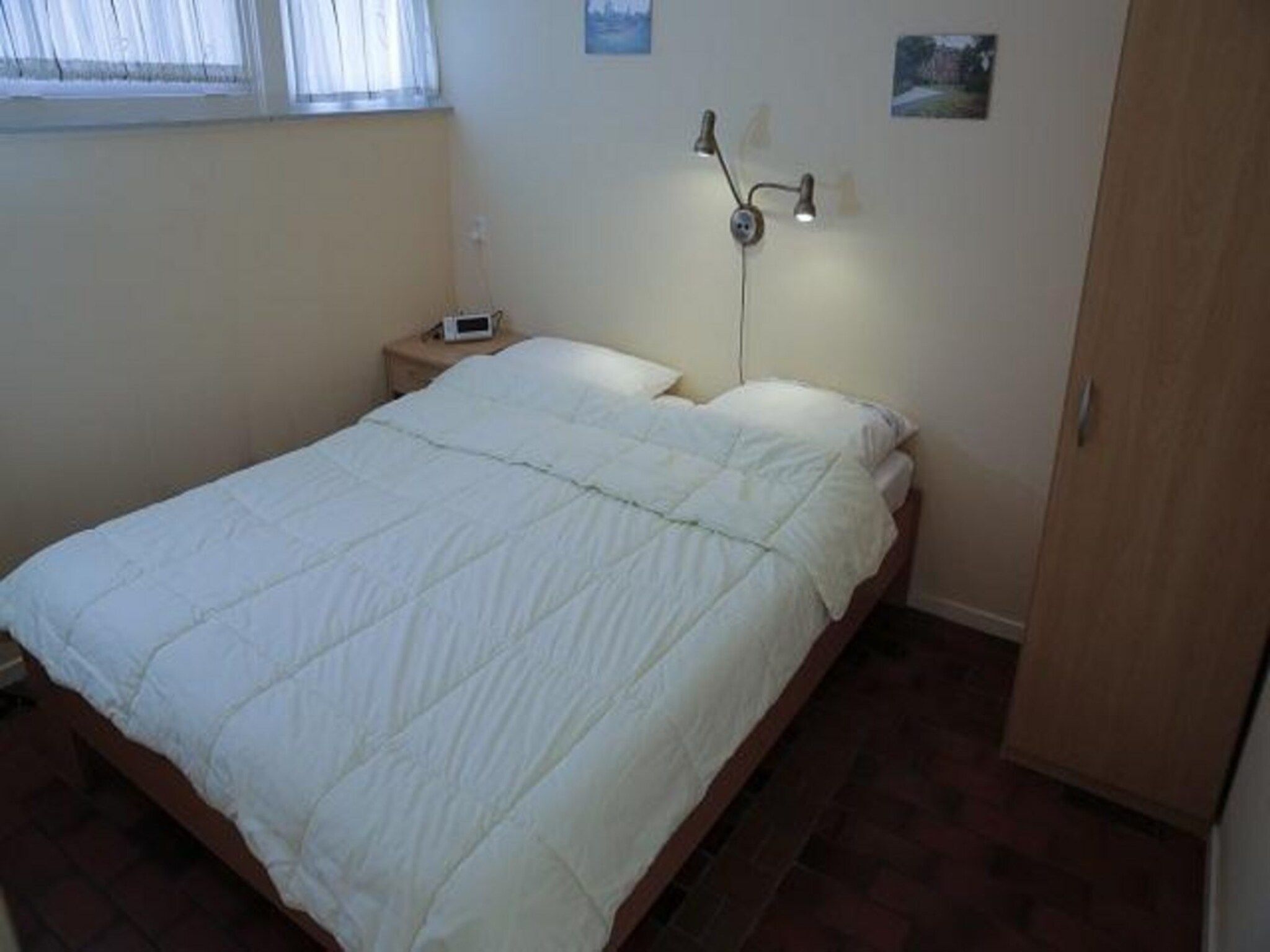 Een slaapkamer van De Schelp 14 in Sint Maartenszee