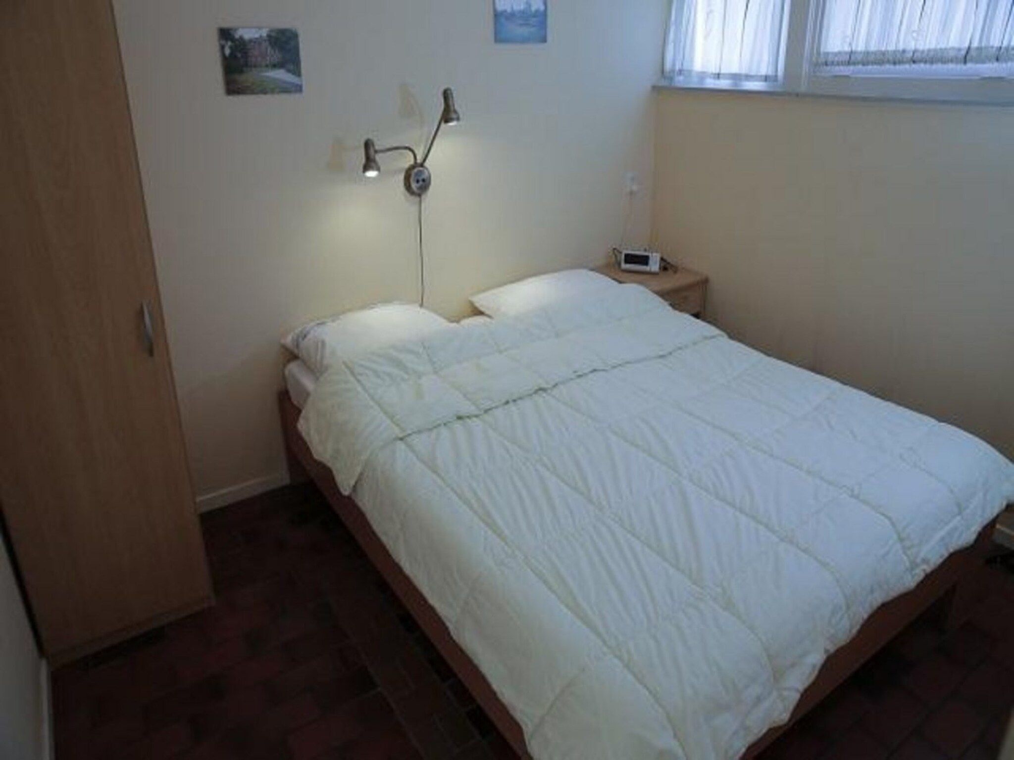 Een slaapkamer van De Schelp 14 in Sint Maartenszee