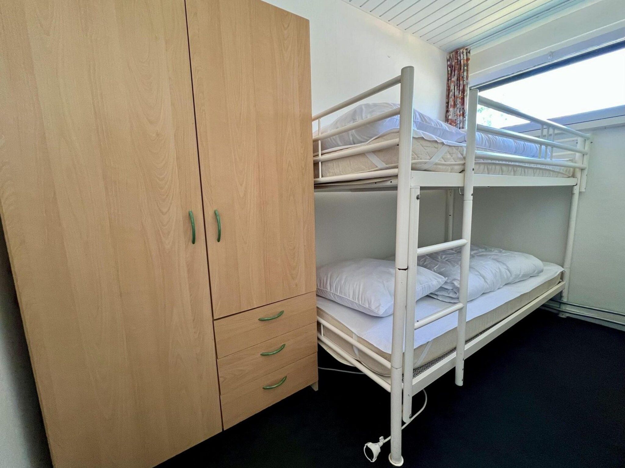 Een slaapkamer van De Schelp 21 in Sint Maartenszee